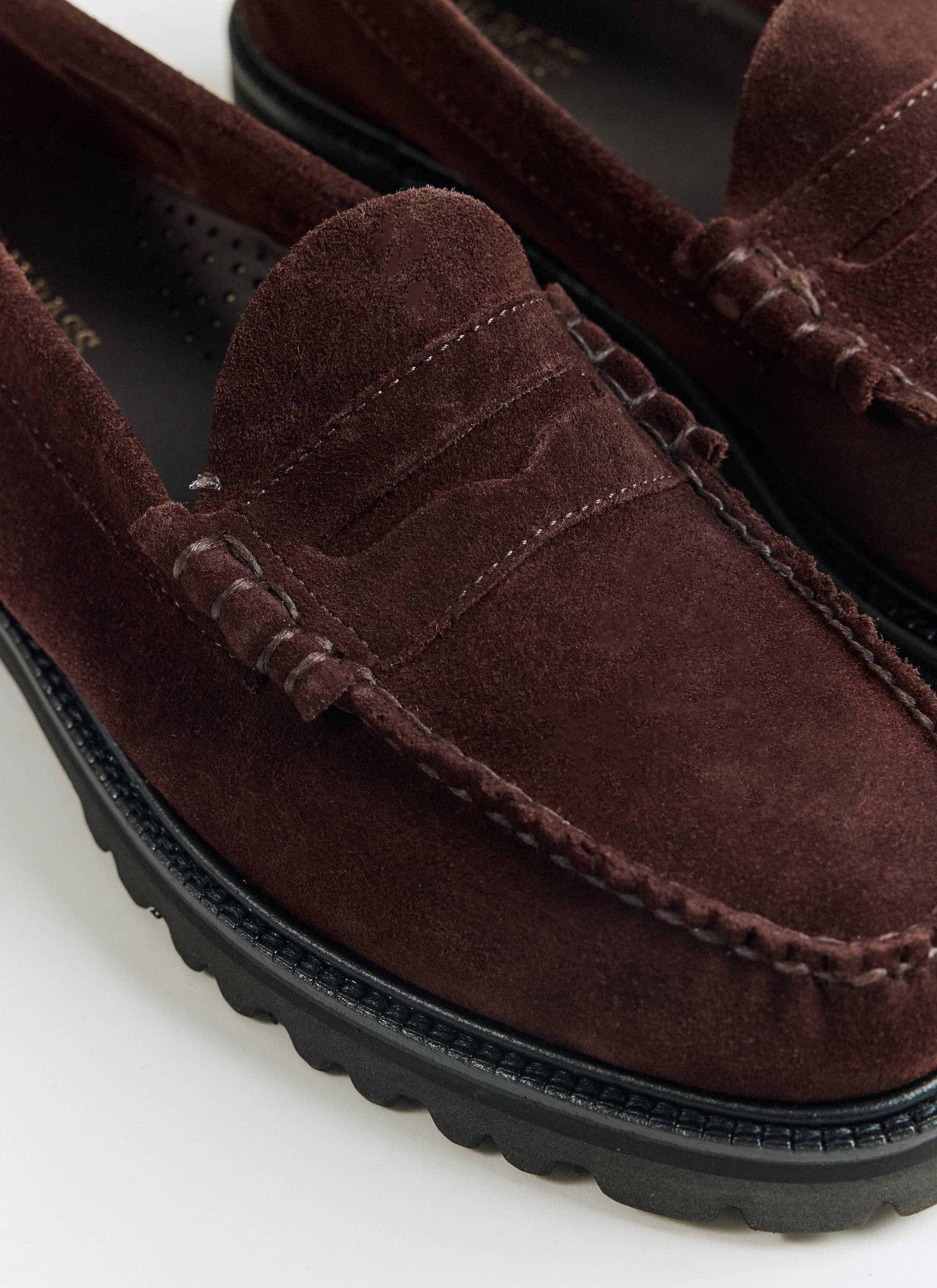 A close-up of the G.H. Bass Weejun 90 Larson loafers in chocolate suede from Percival, showing tonal hand-stitched seams.
