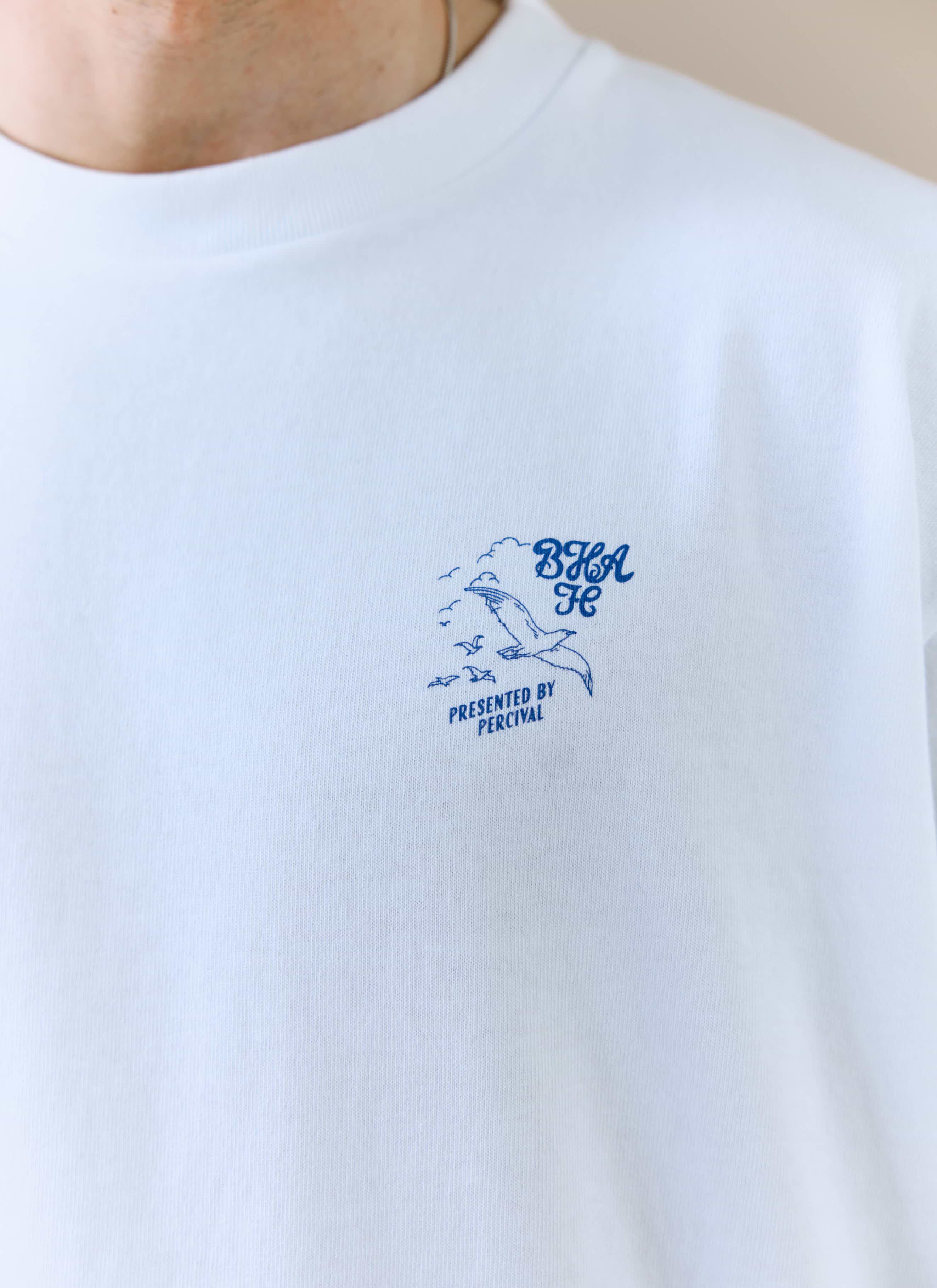 A close-up of the blue chest graphic on the white Beach Front T-shirt from the Percival x Brighton & Hove Albion F.C. range.