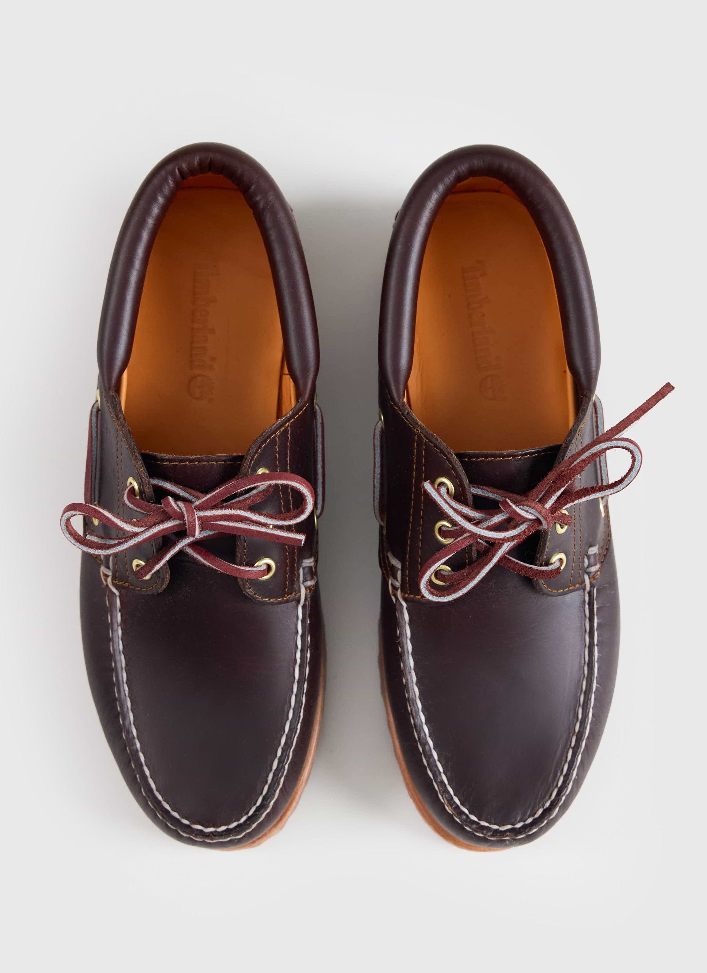 A top-down view of the brown Timberland Authentic Boat Shoe at Percival, showing rawhide laces and contrast moc stitching.
