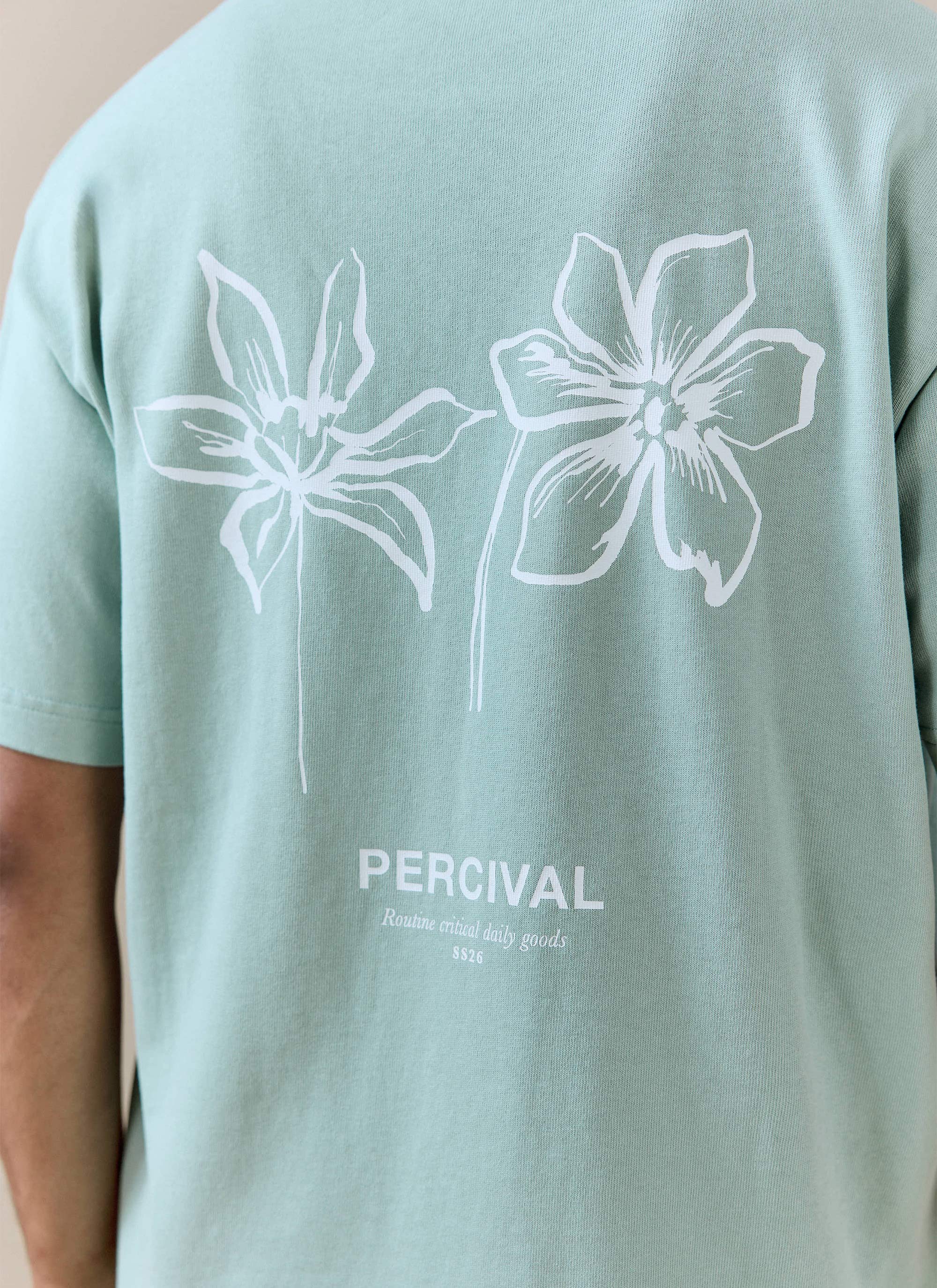 Sage green Percival Melvin Oversized T Shirt in organic cotton featuring white floral line drawings and logo on the back.