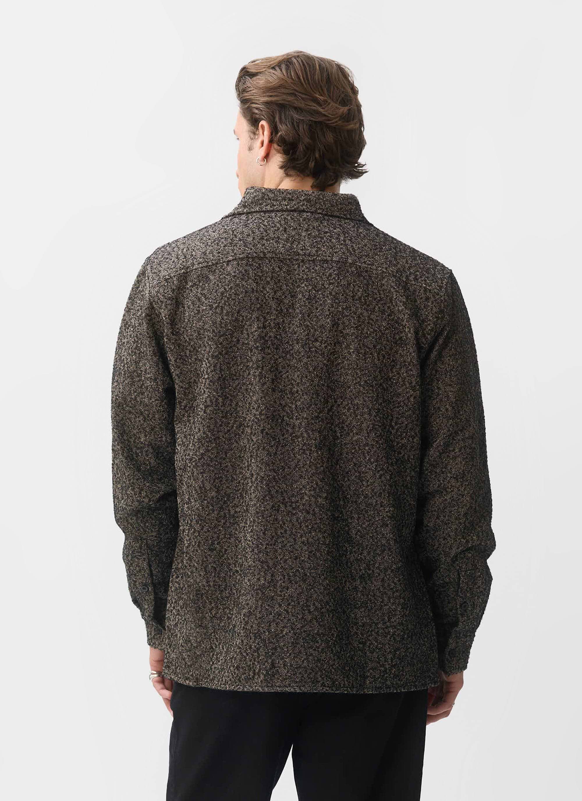 Back view of a model wearing the Percival Blyton Long Sleeve Shirt in a textured grey nep fabric against a white background.