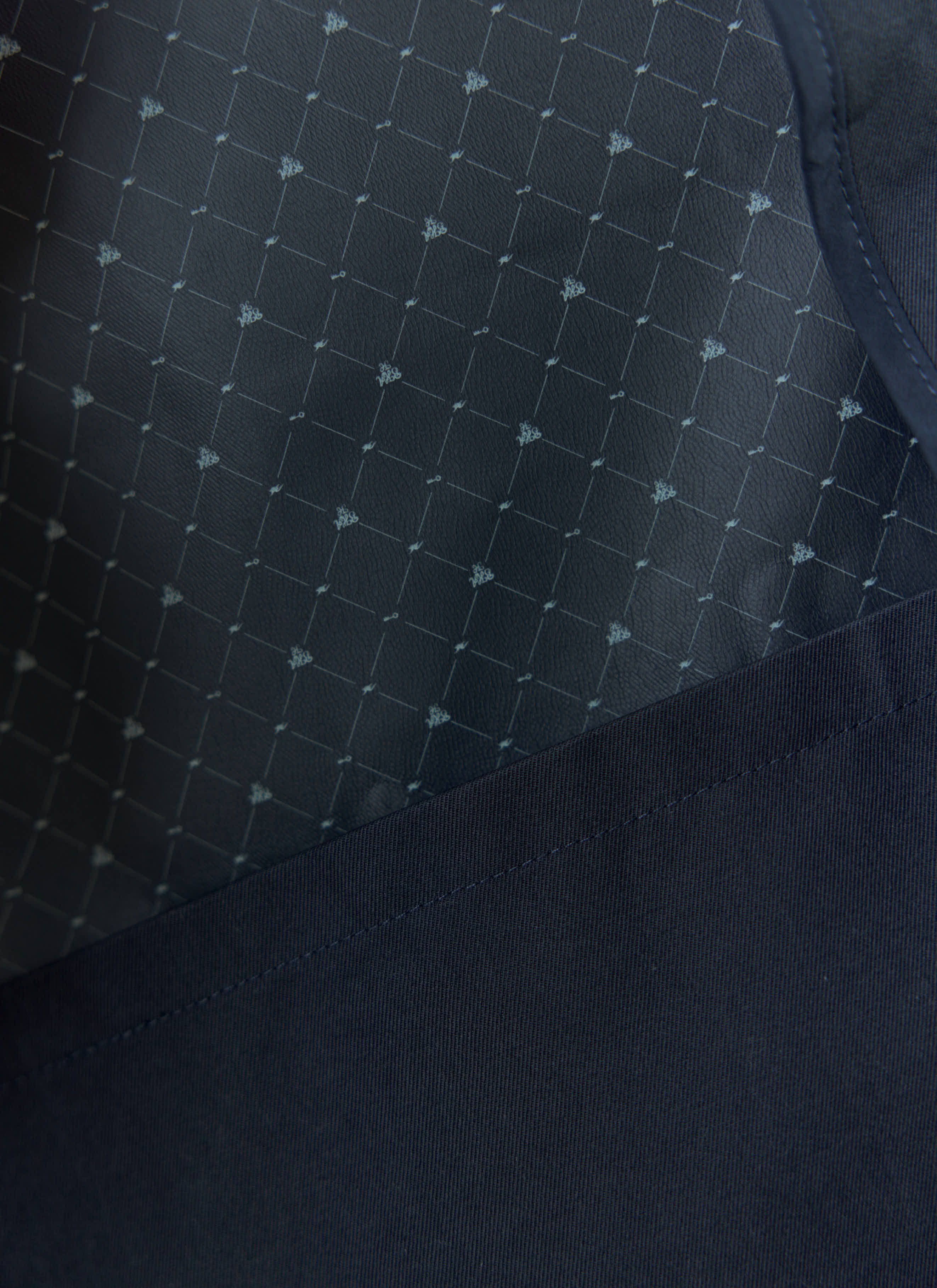 Close-up of the patterned lining inside the Sherlock Trench from the Percival x Brighton & Hove Albion F.C. collab.