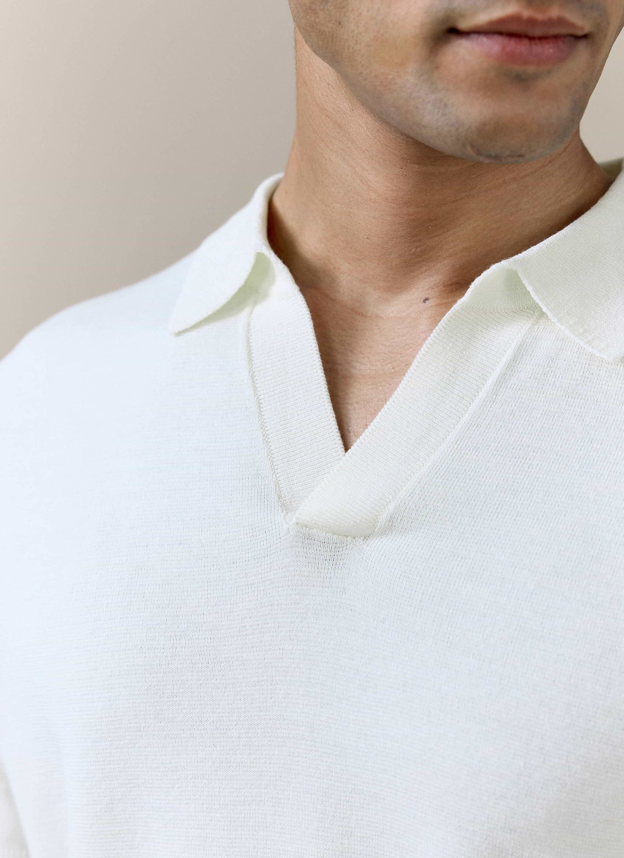 Close-up of the open Johnny collar on the cream Laurence knitted polo by Percival, showing the fine linen-lyocell knit.