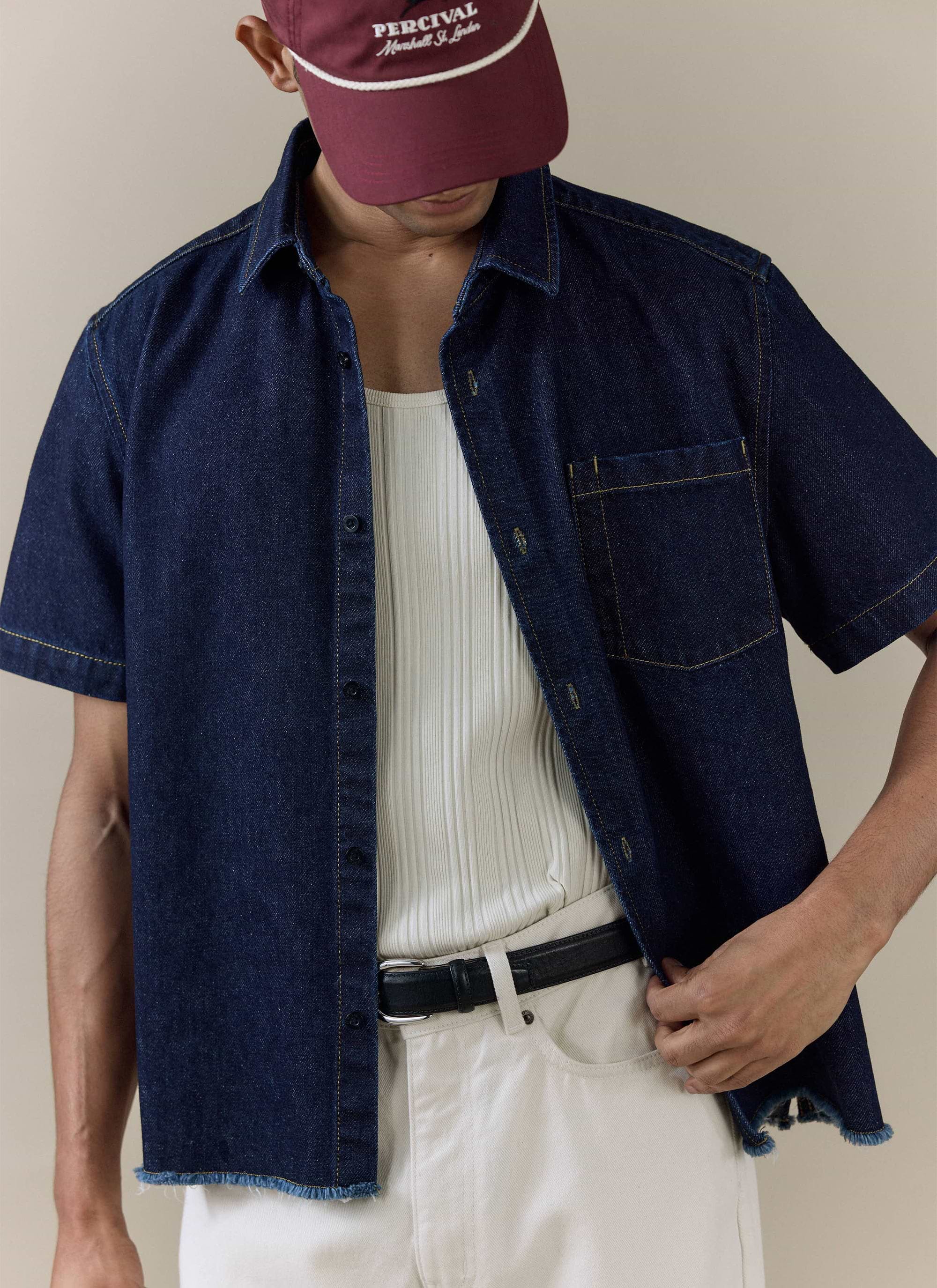 Percival Harley denim shirt in dark indigo cotton, featuring a cropped boxy fit and a raw frayed hem.