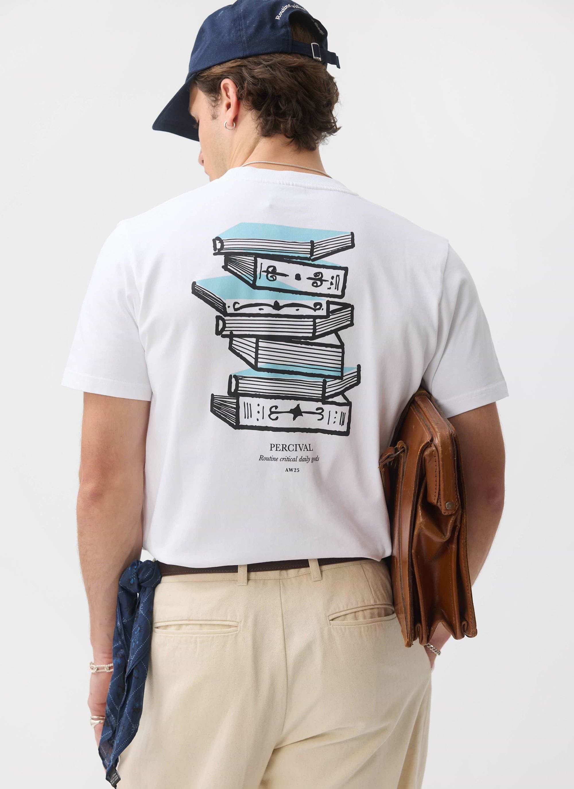 A model seen from behind wearing the white Duke T-shirt from Percival, showing the large stack of books back graphic.