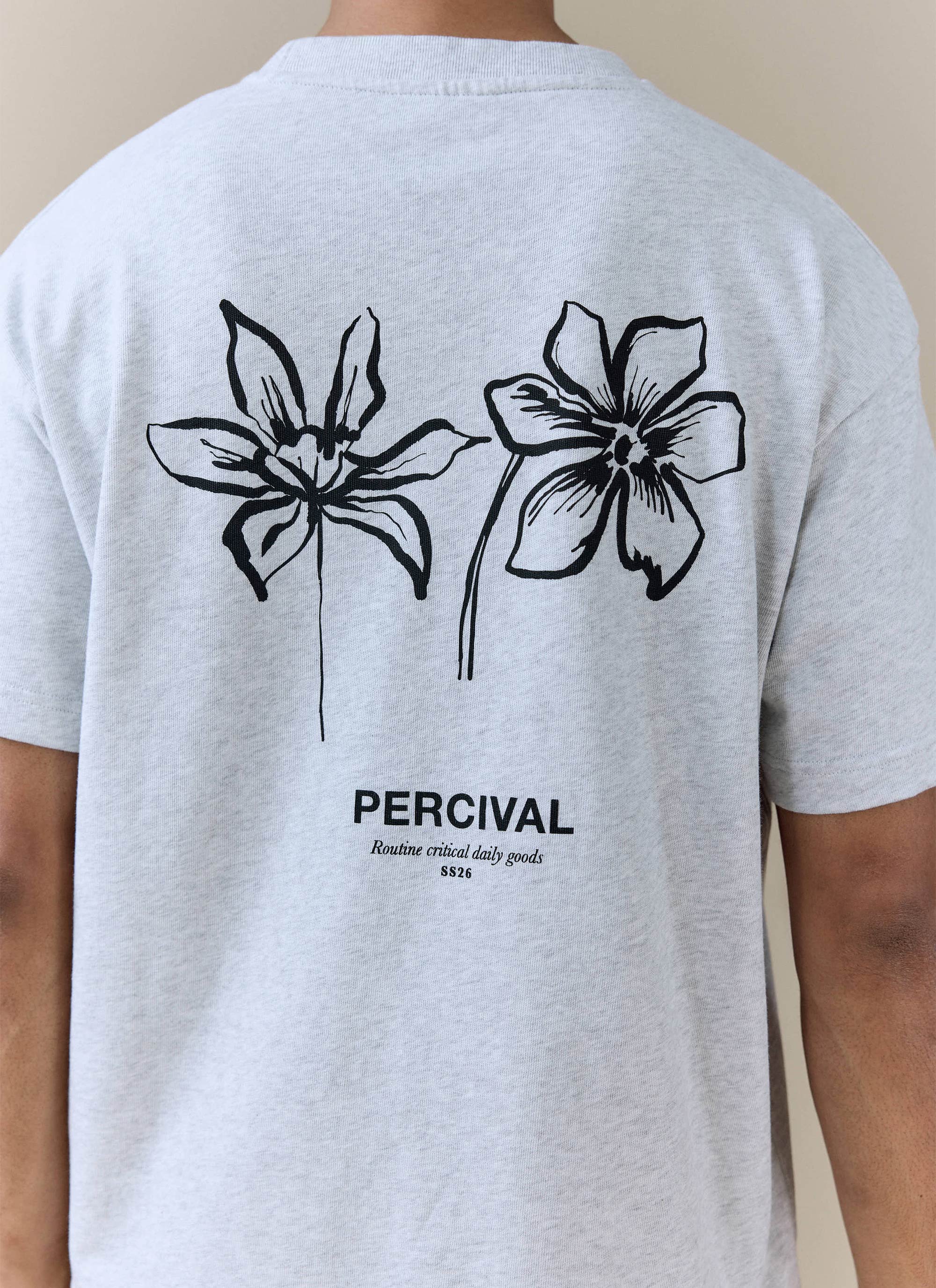 Back of the grey Percival Melvin Oversized T-Shirt in organic cotton, featuring black floral line art and text.