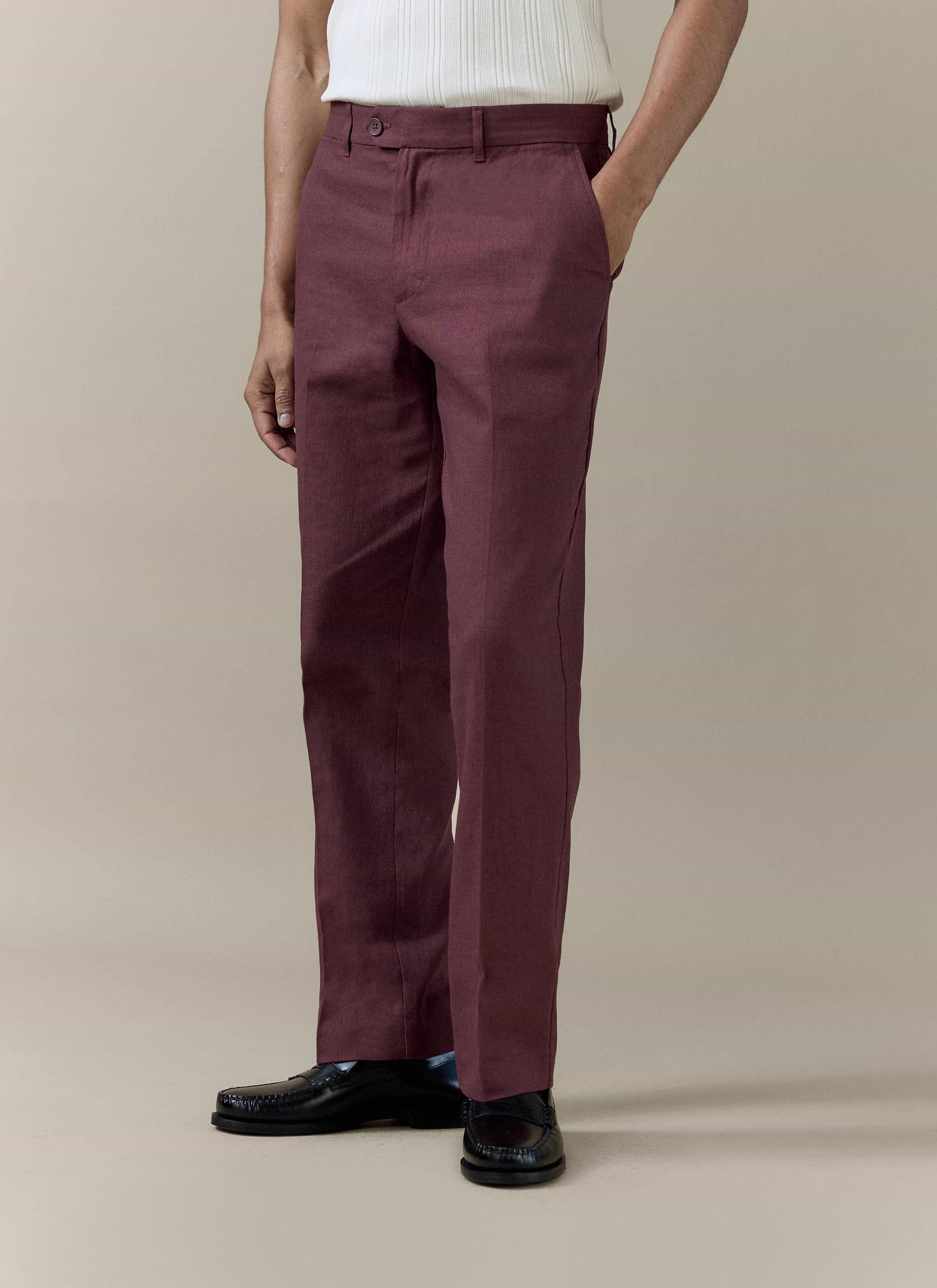 Merlot tailored linen trousers by Percival, featuring a sharp pressed crease and a straight-leg fit.
