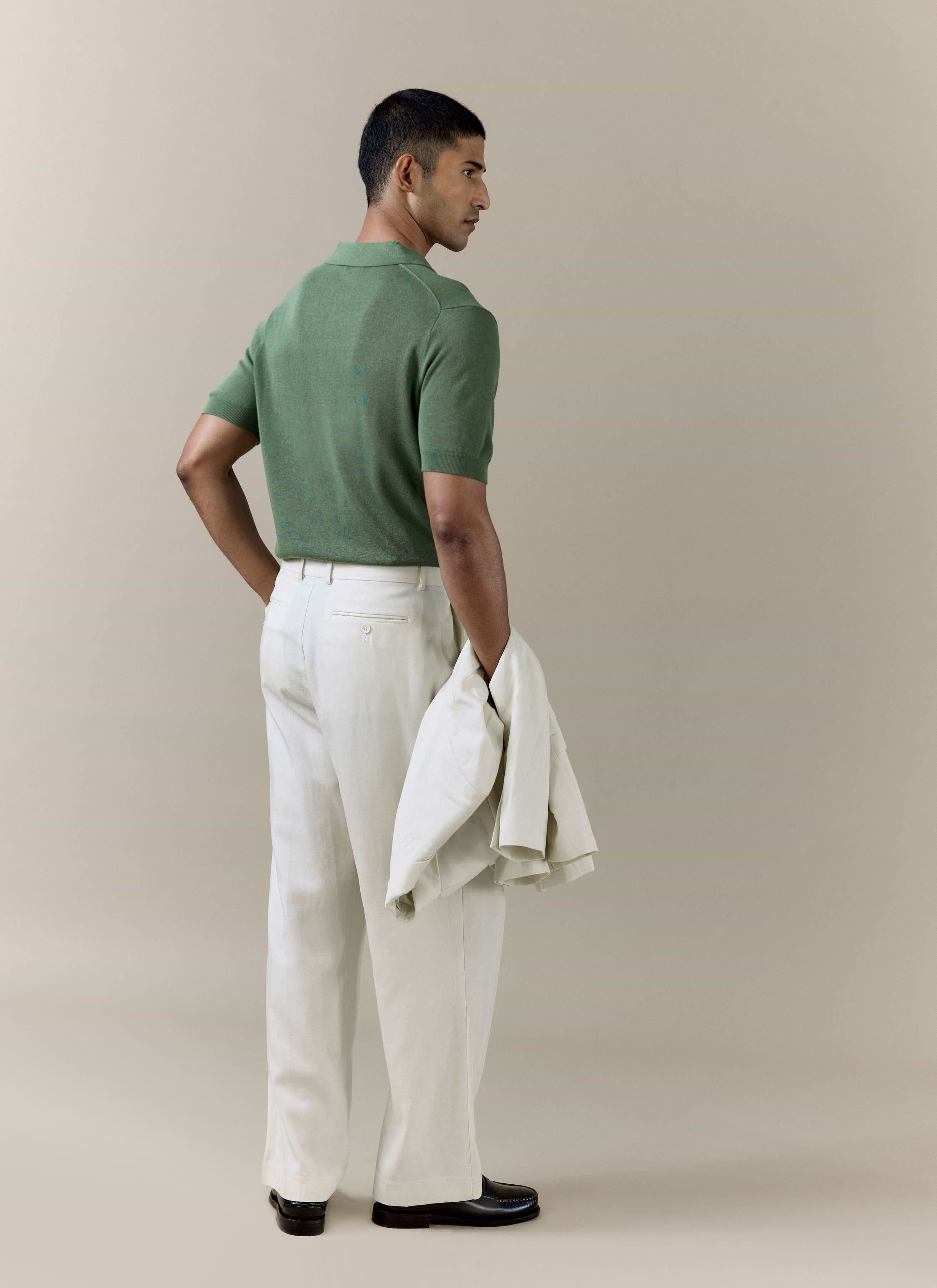 Percival Laurence knitted polo in forest green linen blend, styled with cream trousers and a matching jacket.