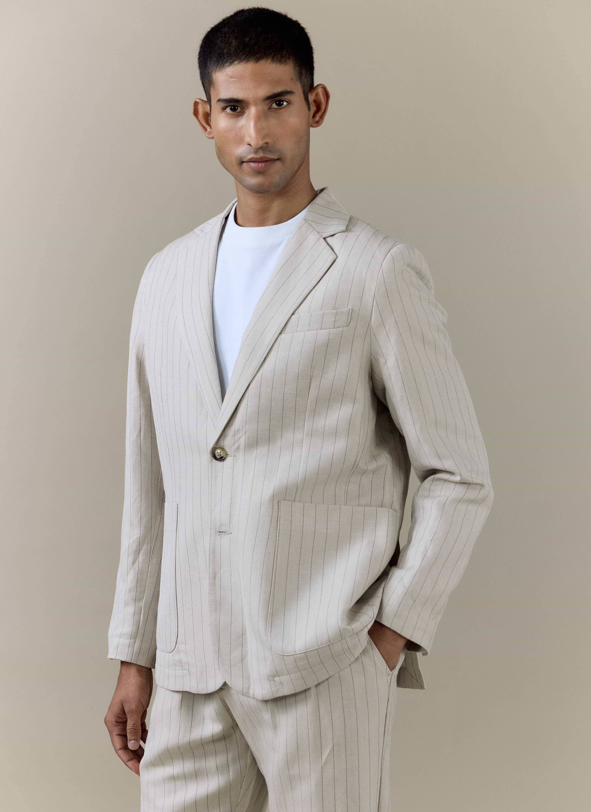Percival Striped Tailored Blazer in cream pinstripe linen blend, styled with matching trousers and a white t-shirt.