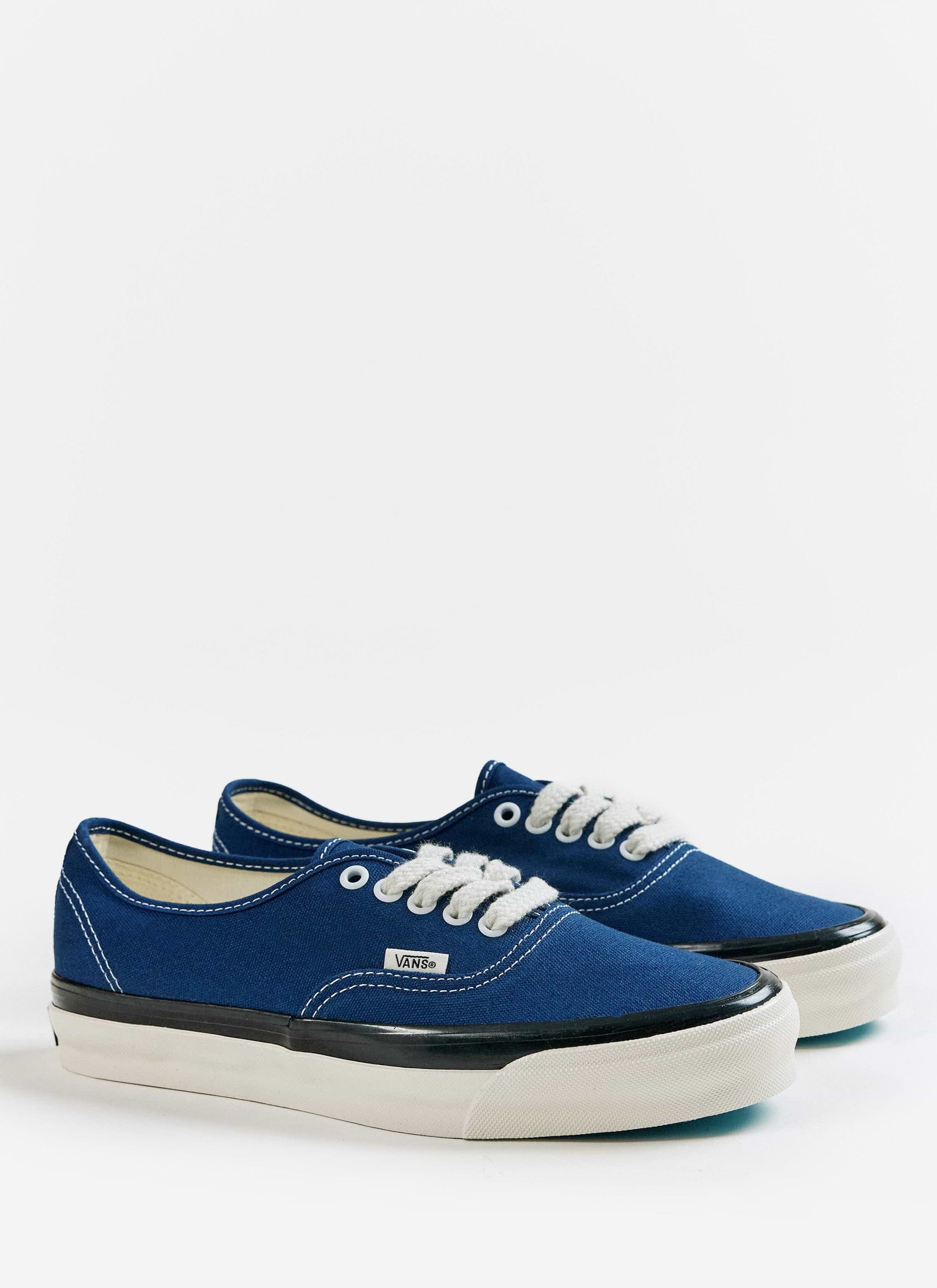 A pair of blue Vans Premium Authentic 44 Shoes with off-white soles, available at Percival.