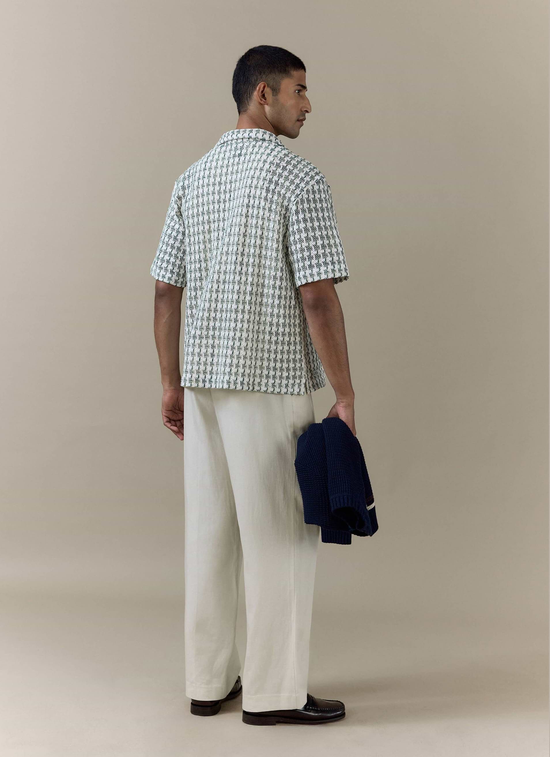 Rear view of the green textured Freddie Crochet Boxy Shirt from Percival, featuring an open-weave cotton construction.