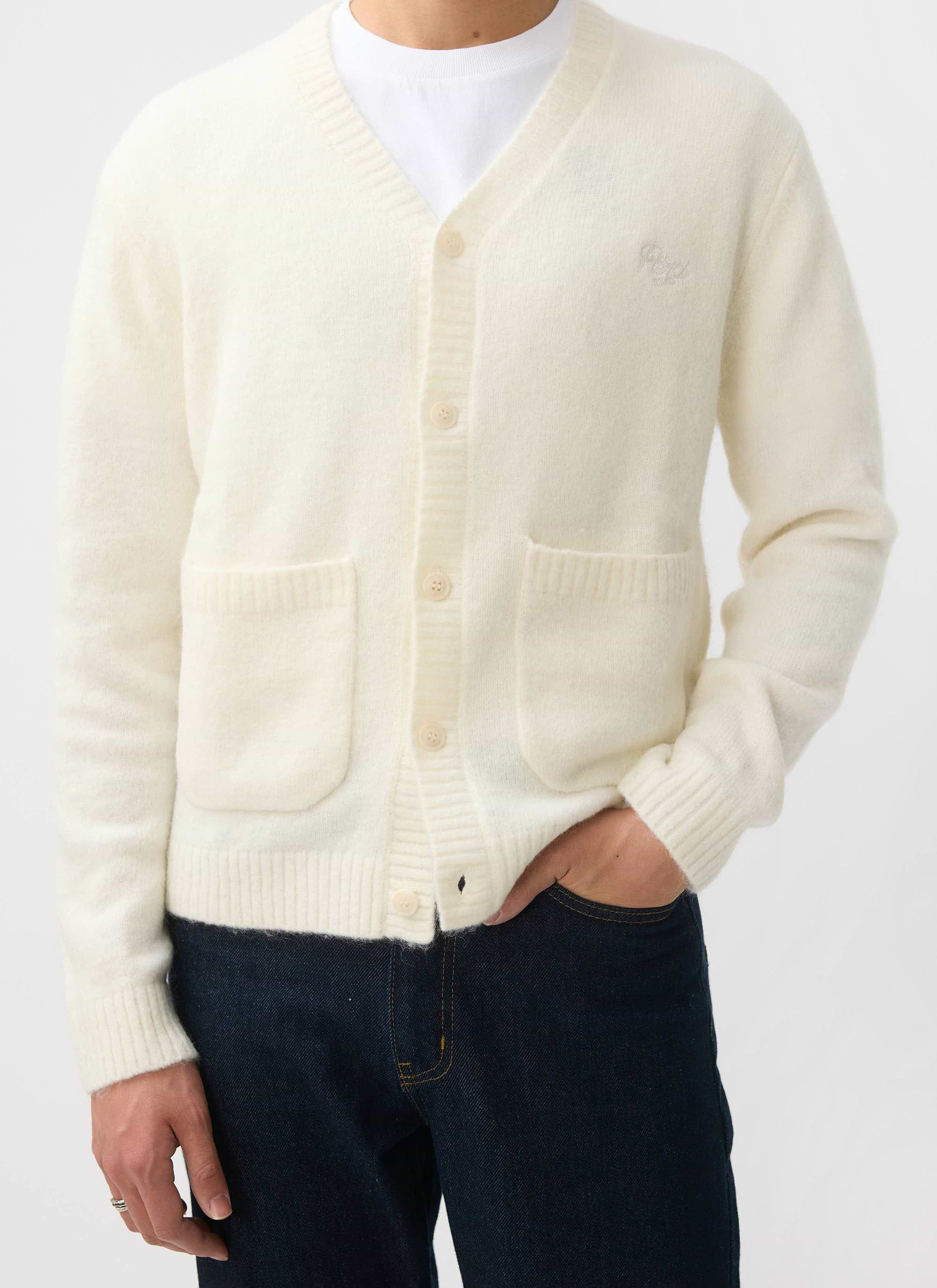 A model wears the Percival White Glove Cardigan in ecru mohair, styled with a white t-shirt and dark jeans.
