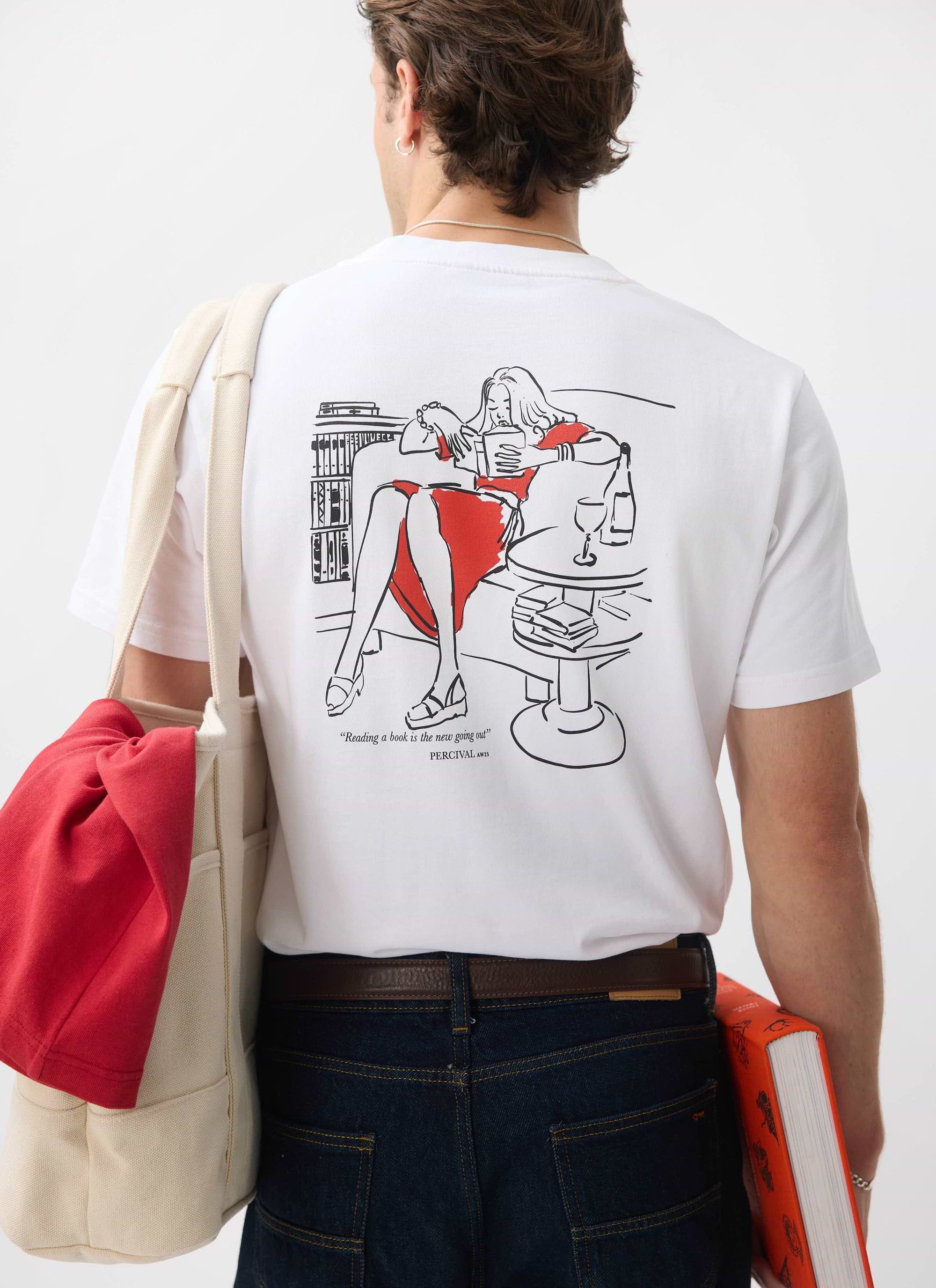 A model seen from behind wearing the Percival Greatest Bookshop t-shirt, showing the 'reading' illustration on the back.