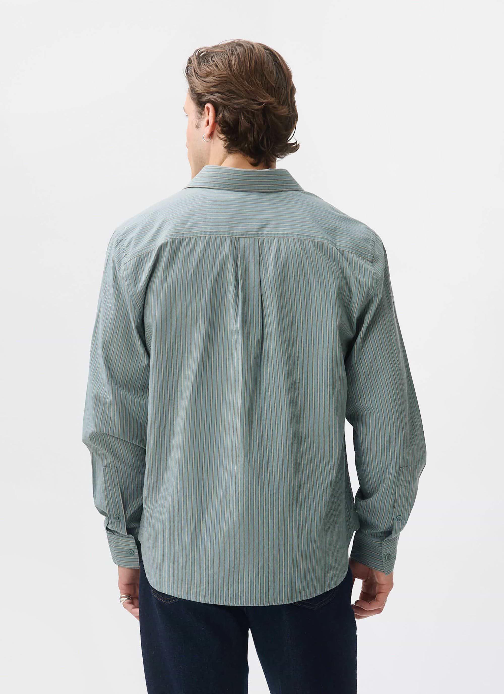 A model shows the back of the Percival Clancy Striped Long Sleeve Shirt in blue, highlighting the fit and pattern.