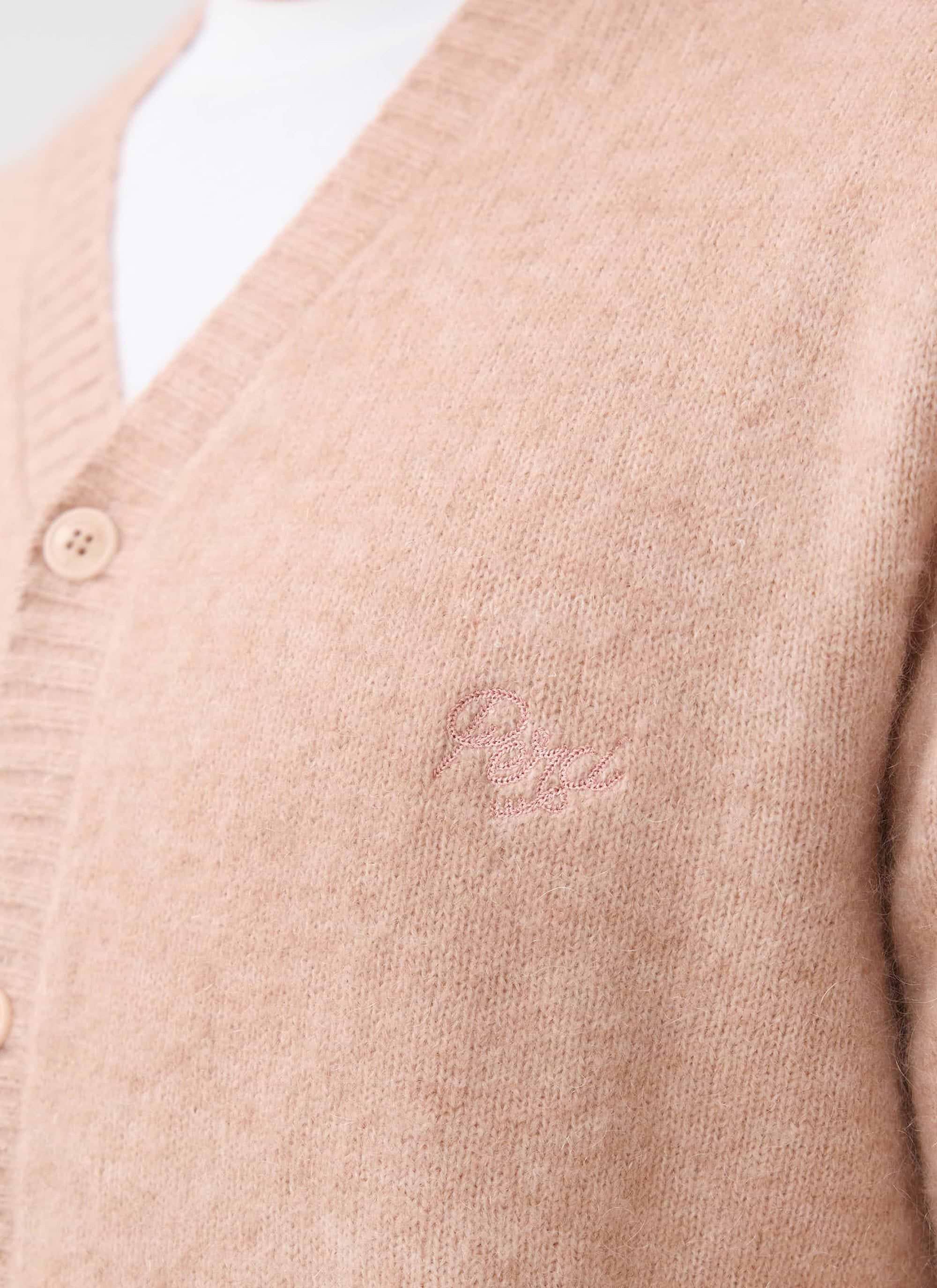 Close up of the pink mohair White Glove Cardigan by Percival, showing the tonal chest embroidery.