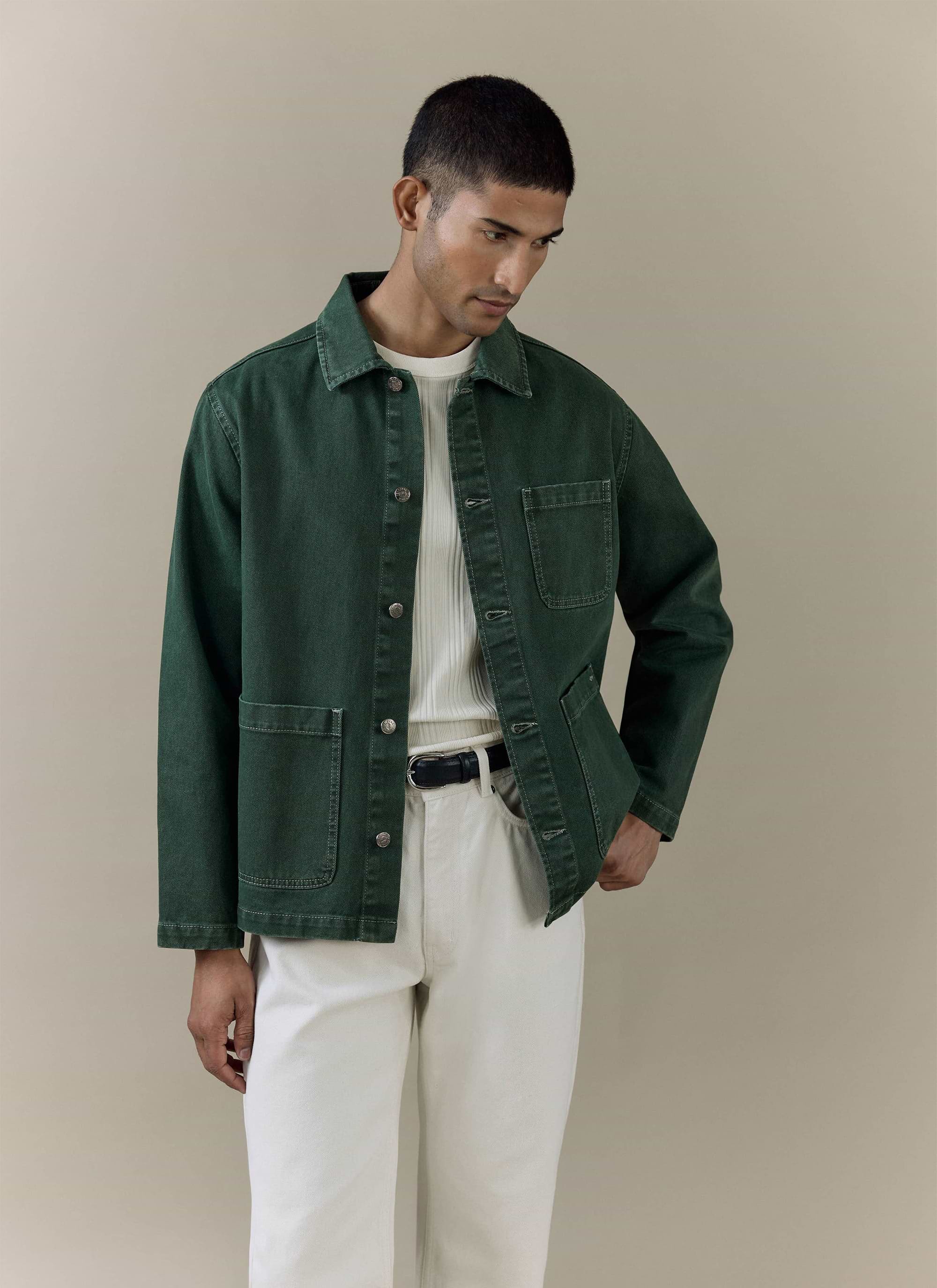 Model wearing the Percival Oliver Chore Jacket in forest green cotton canvas with a vintage wash.