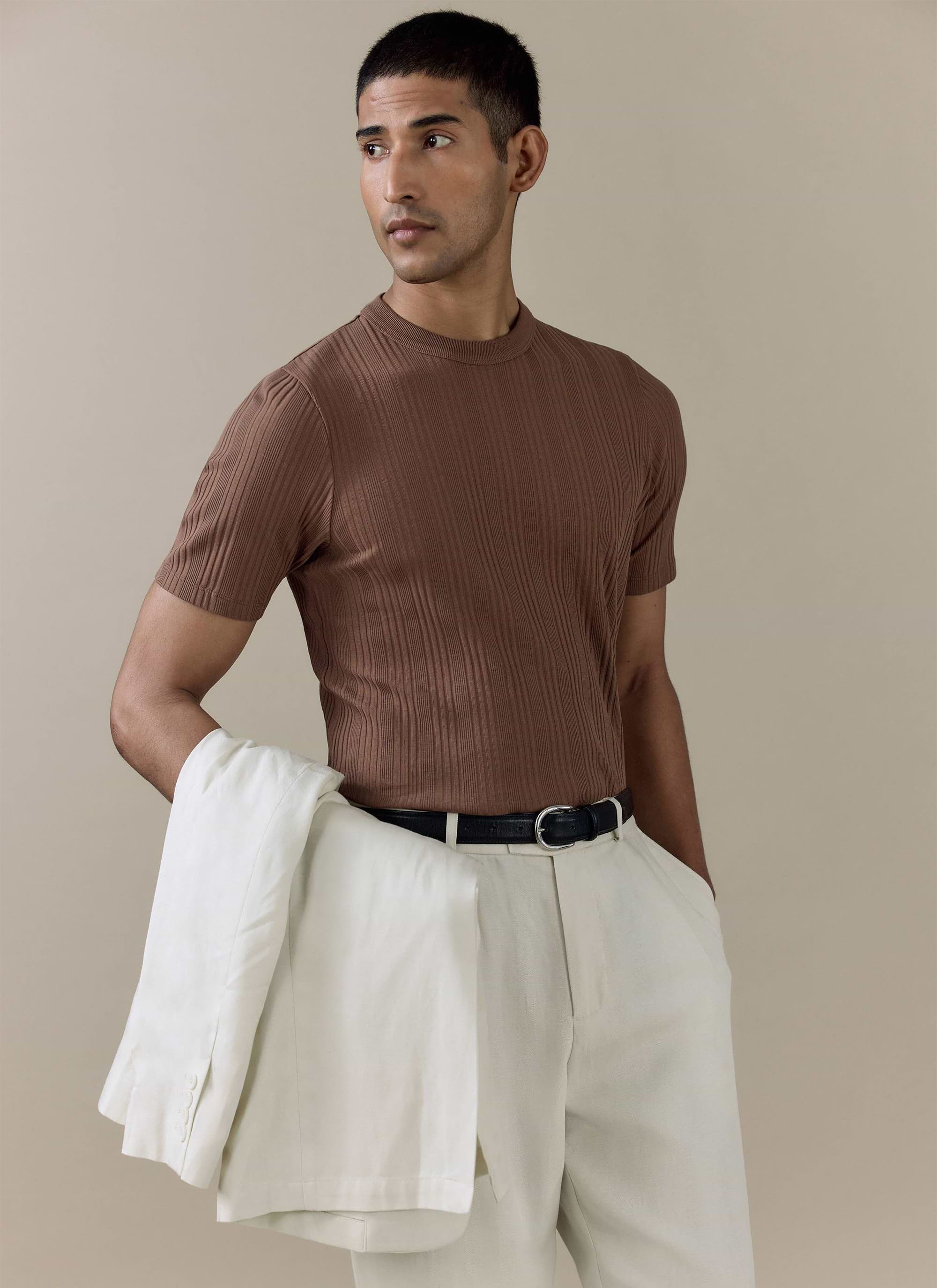Brown Leon Ribbed T Shirt in cotton by Percival, styled on a model with white trousers and a jacket.