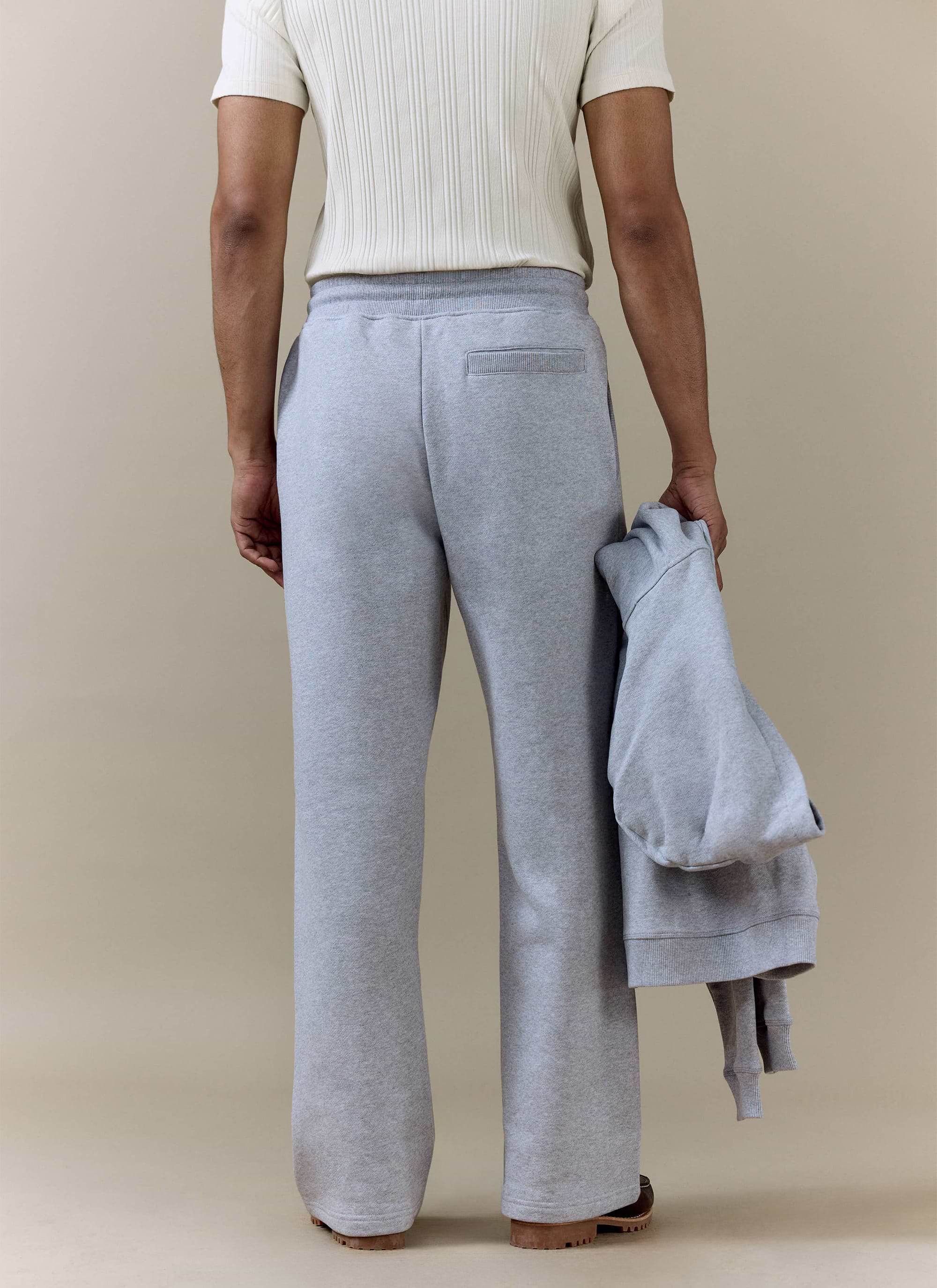 Back view of the Percival Chronicle Straight Leg Trackpants in grey cotton jersey, showing the fit and rear pocket.