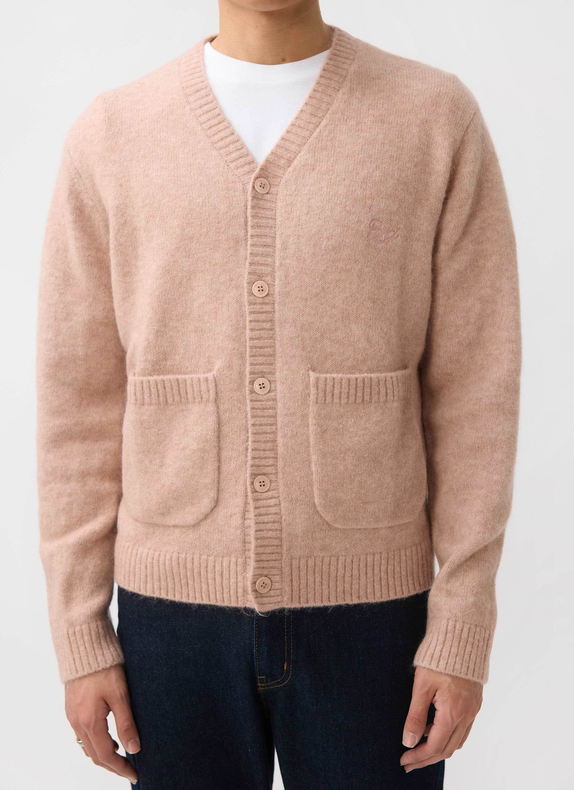 A model wears the Percival White Glove Cardigan in pink, a soft mohair blend, styled with a simple white t-shirt.