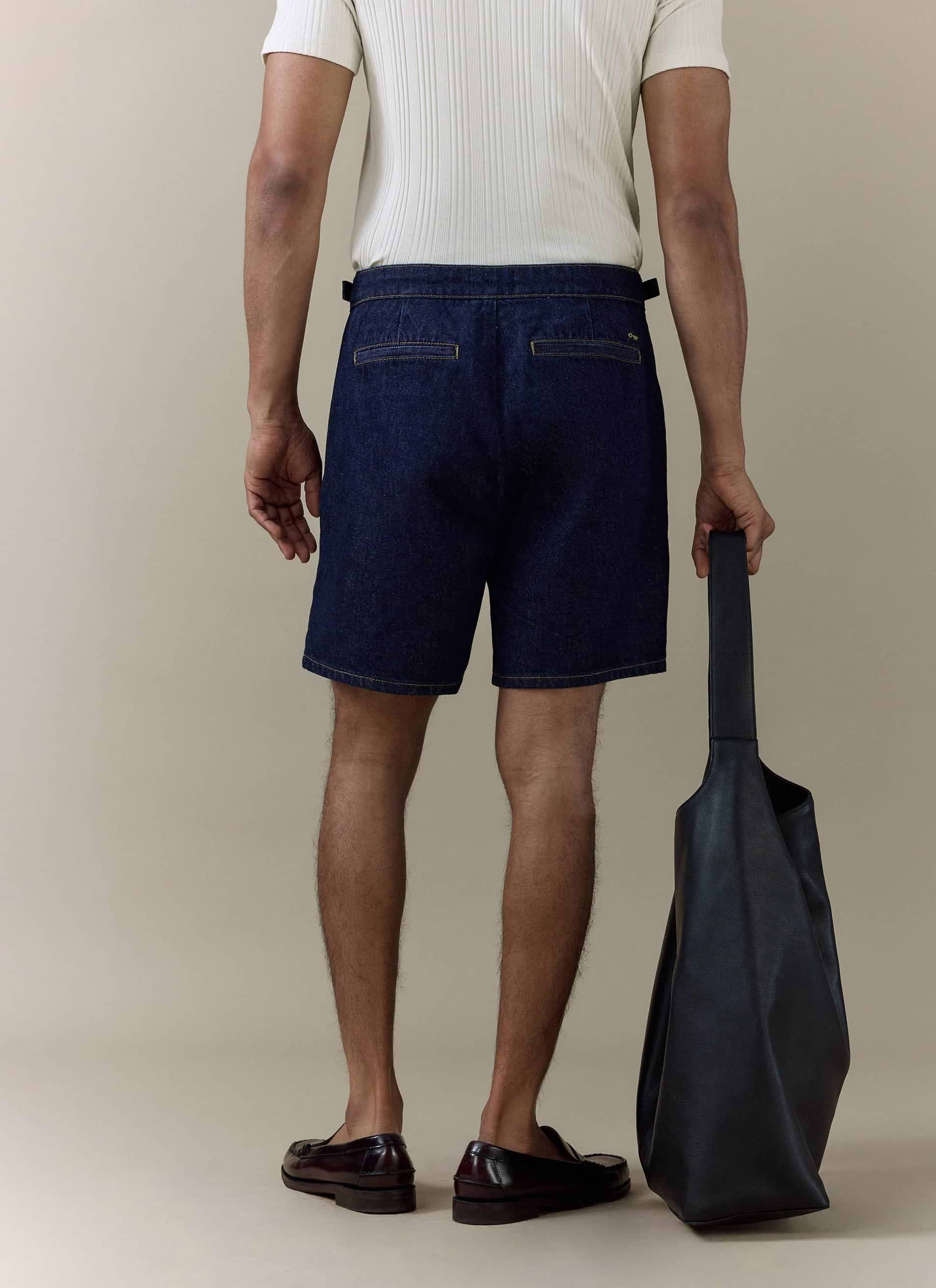 Percival dark indigo cotton Blake Double Pleated Shorts from behind; pair with the Harley Denim Shirt for the full set.