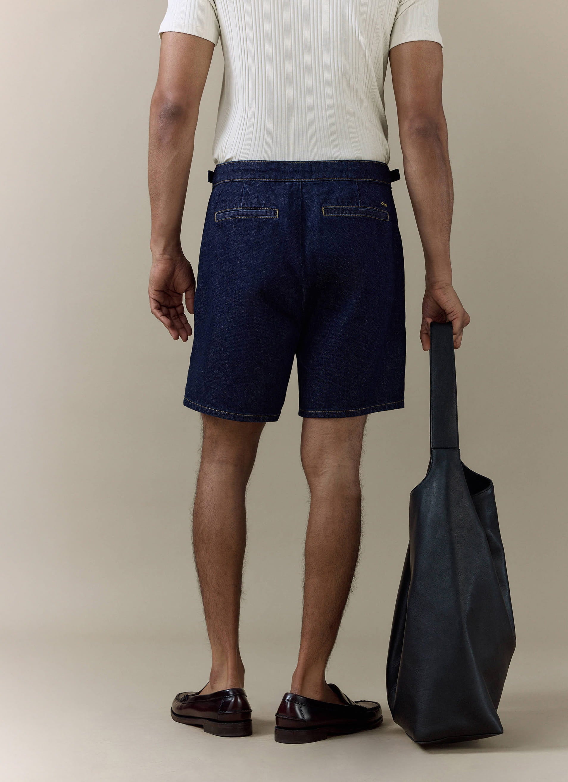 Percival dark indigo cotton Blake Double Pleated Shorts from behind; pair with the Harley Denim Shirt for the full set.
