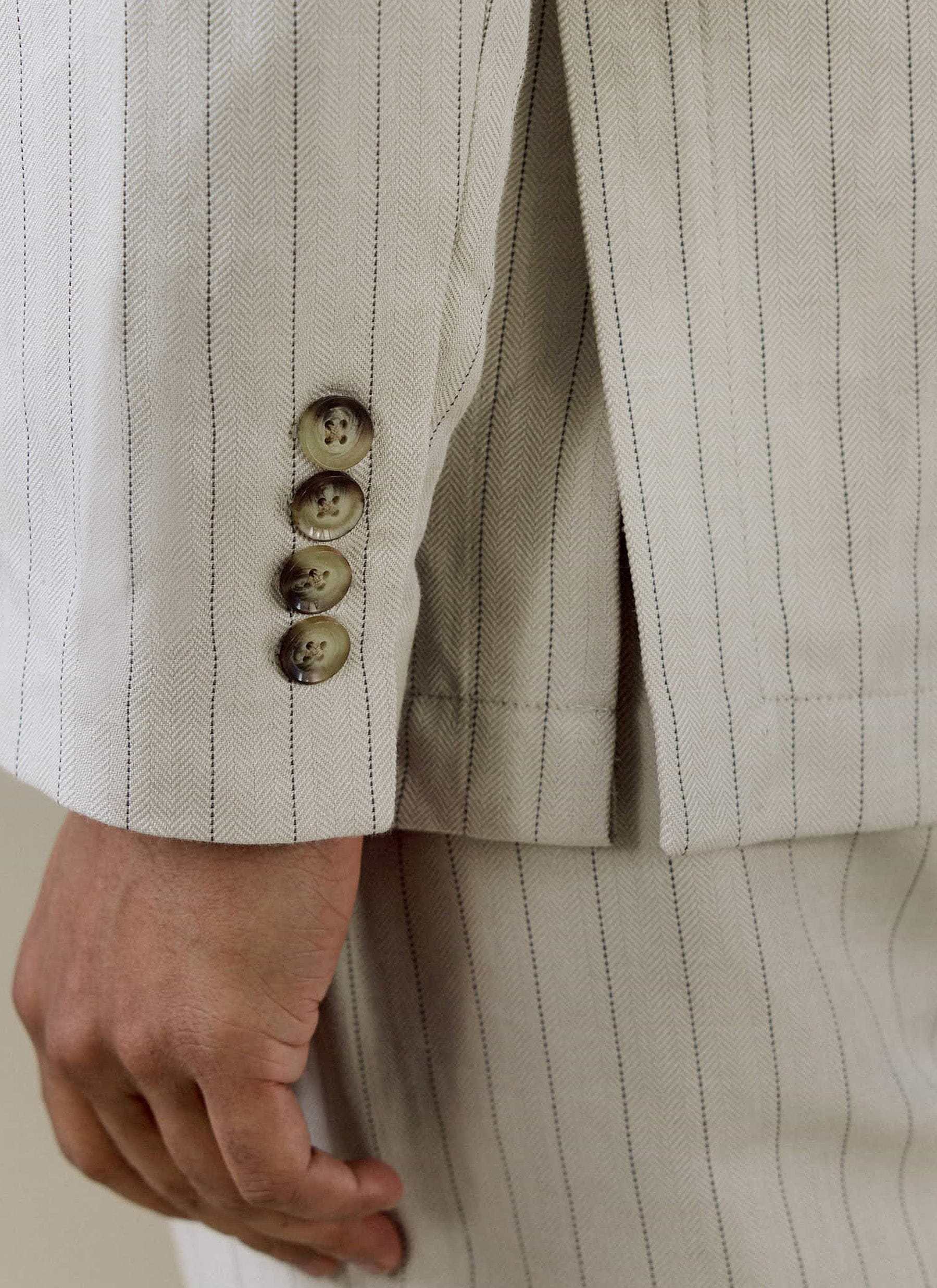 Cream Percival Striped Tailored Blazer close-up, showing the pinstripe linen fabric and horn-effect sleeve buttons.