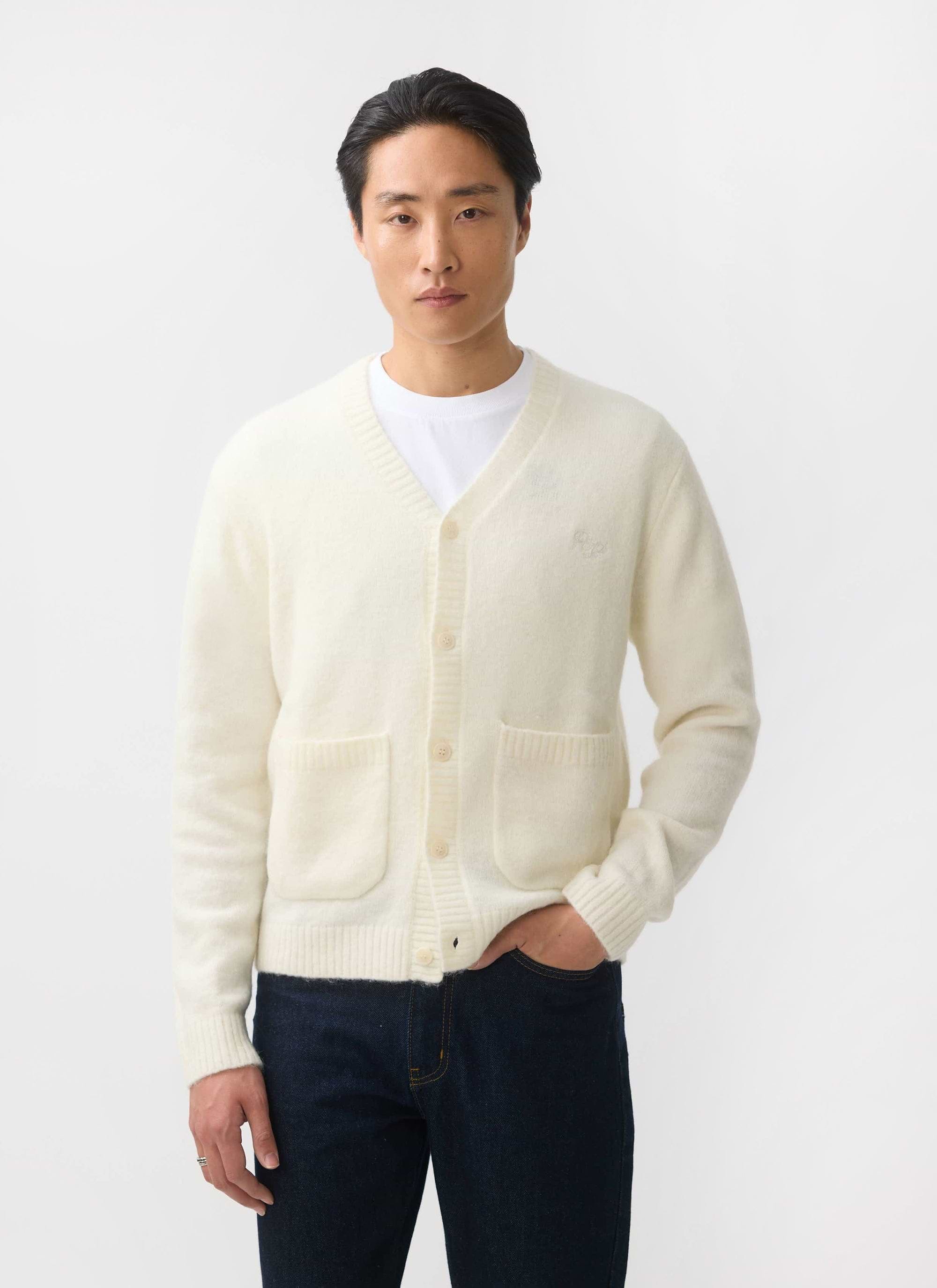 A model wears the Percival White Glove Cardigan in ecru, a soft mohair blend knit, against a white studio background.