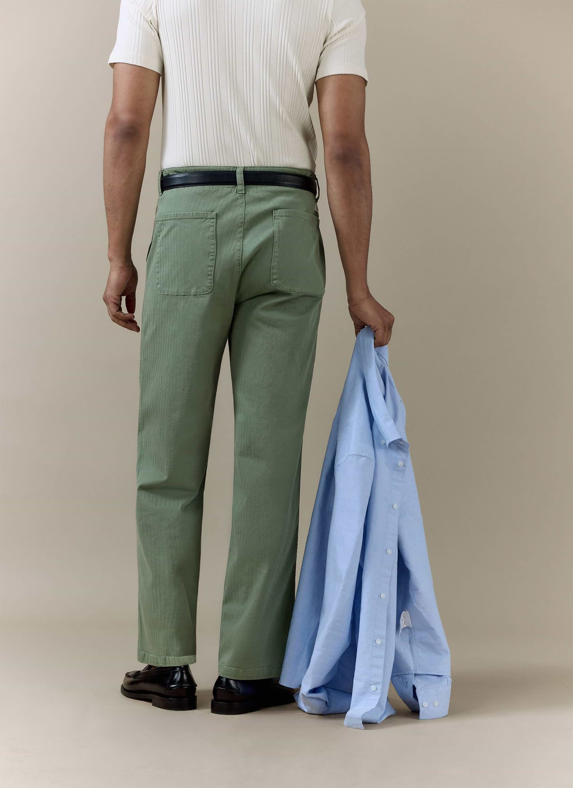 Rear view of the sage green Lungo Herringbone Straight Trousers by Percival, featuring a textured cotton finish.