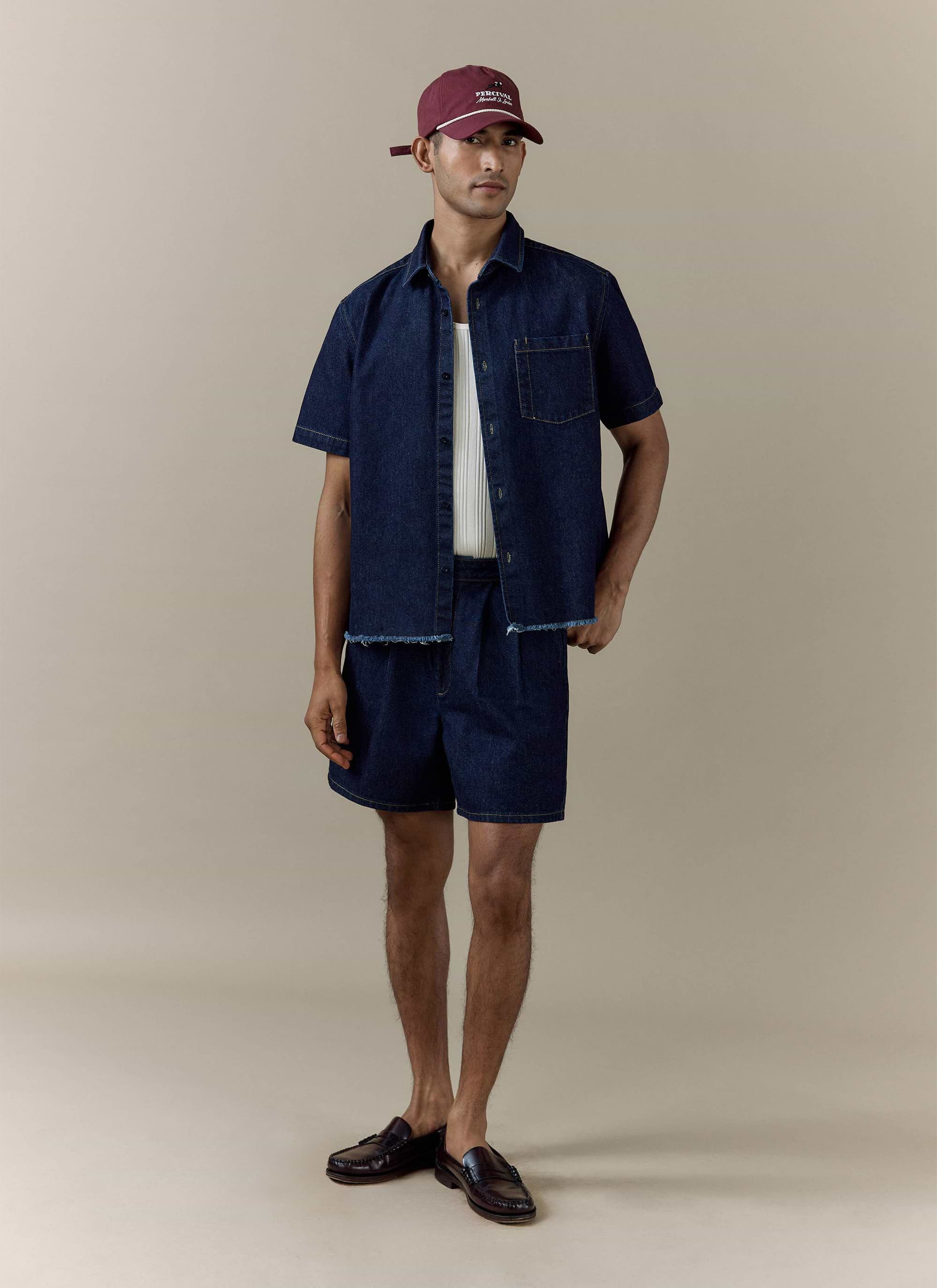 Percival dark indigo Harley denim cropped shirt paired with matching Blake double pleated shorts.