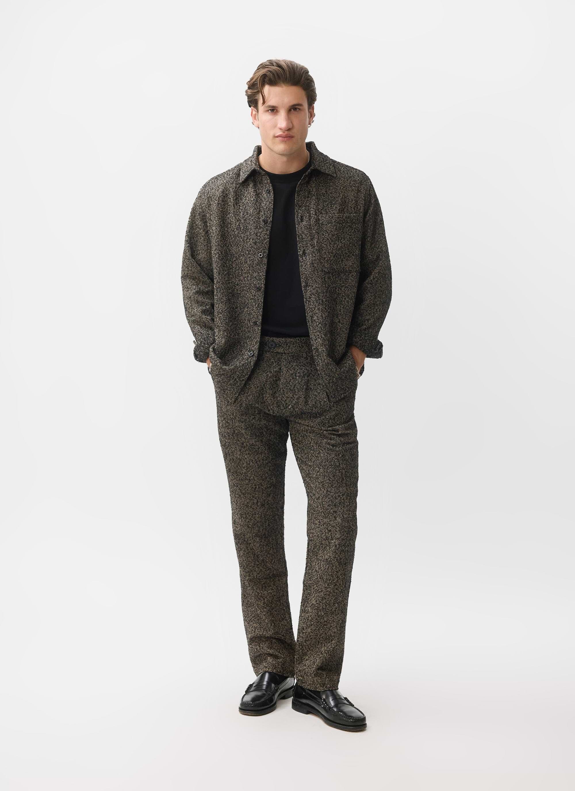 A model wears the Percival Blyton Long Sleeve Shirt and matching trousers in grey as a co-ord against a white background.