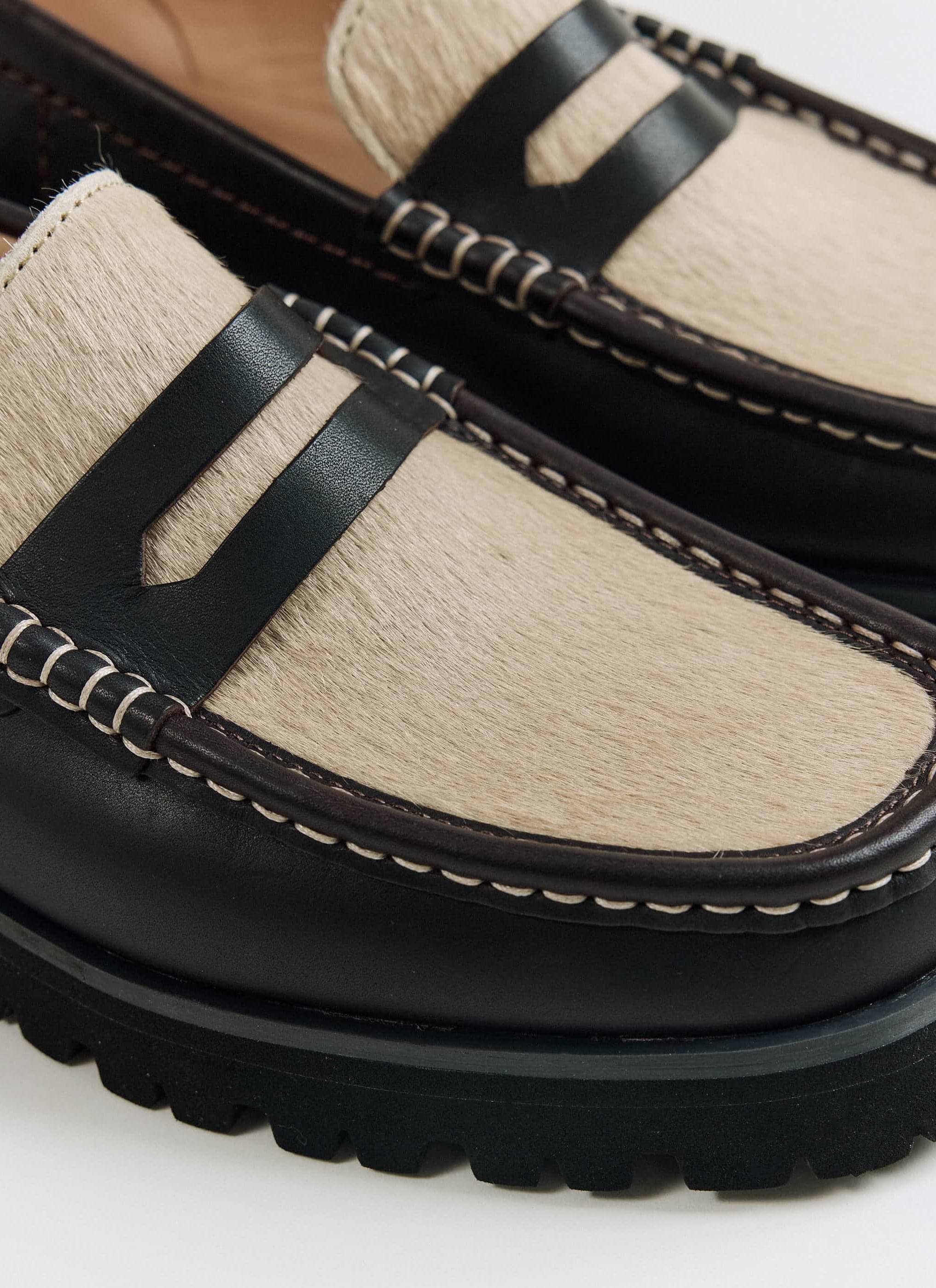 Close-up of the maple hair-on vamp and saddle on the brown Clarks Originals Yukoner Penny Loafer from Percival.