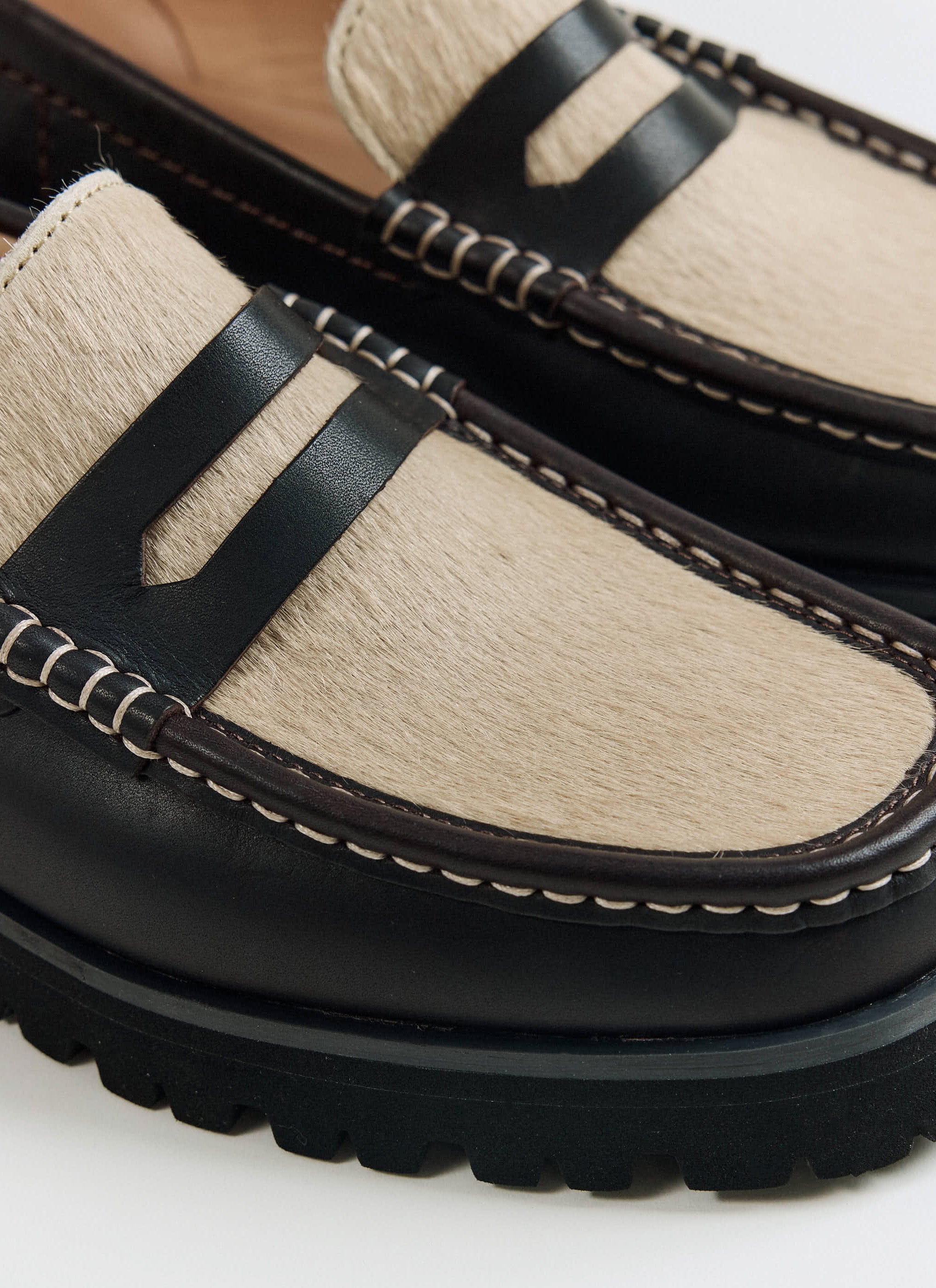 Close-up of the maple hair-on vamp and saddle on the brown Clarks Originals Yukoner Penny Loafer from Percival.