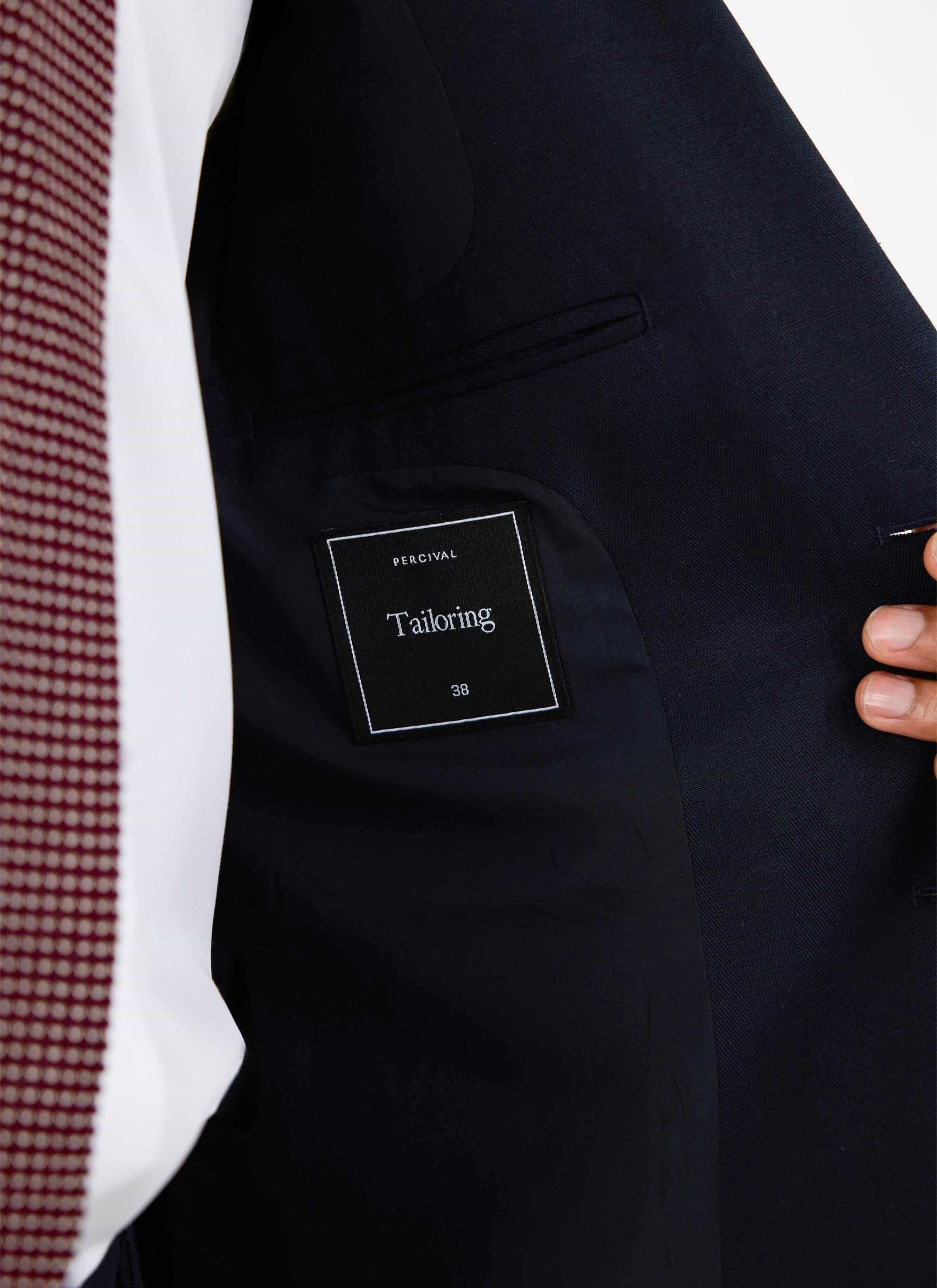 A close-up of the interior of the navy Lyocell Regular Blazer, showing the signature Percival 'Tailoring' label.