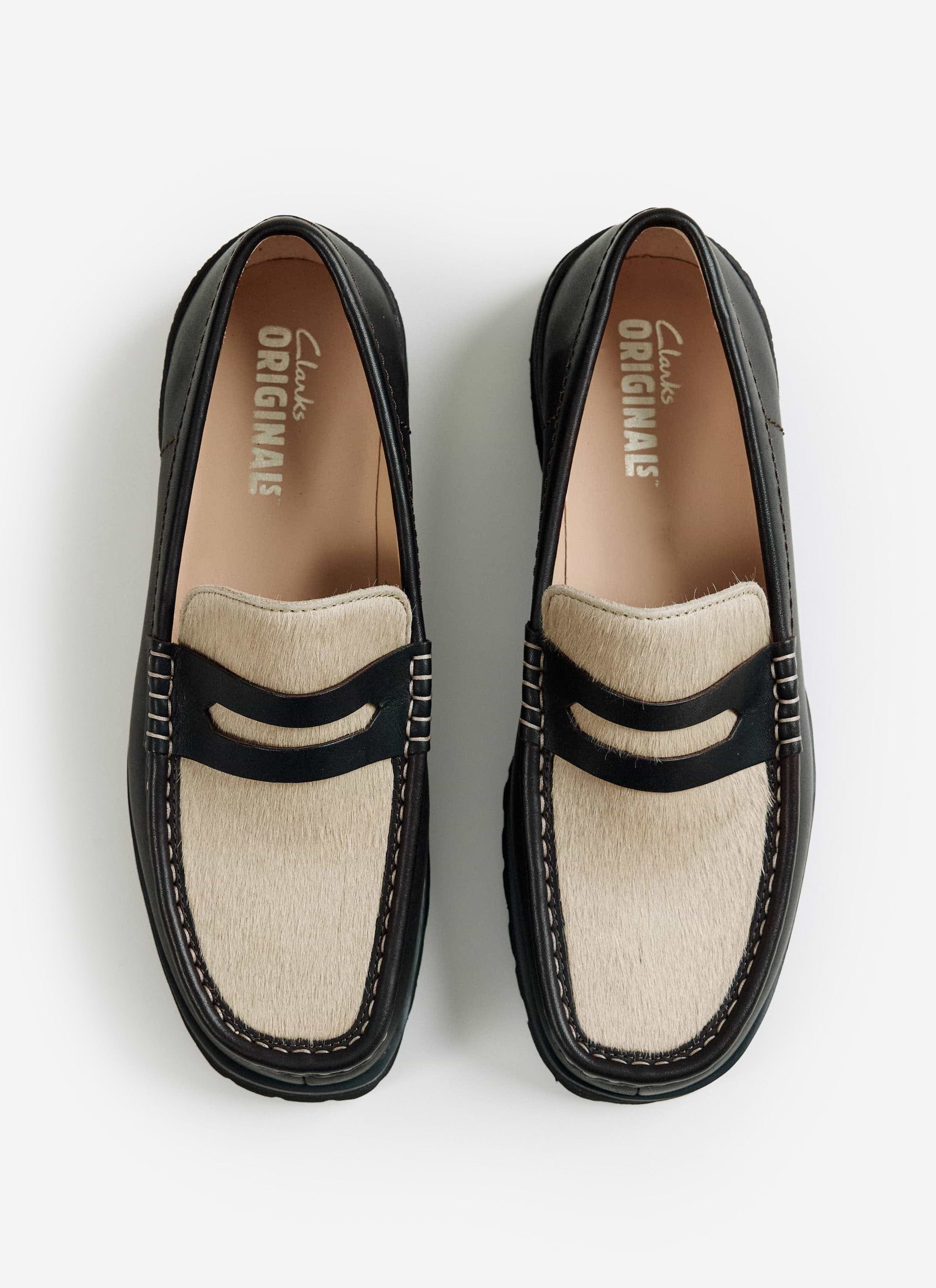 A top-down view of the brown Clarks Originals Yukoner Penny Loafers with a maple hair-on vamp from Percival.