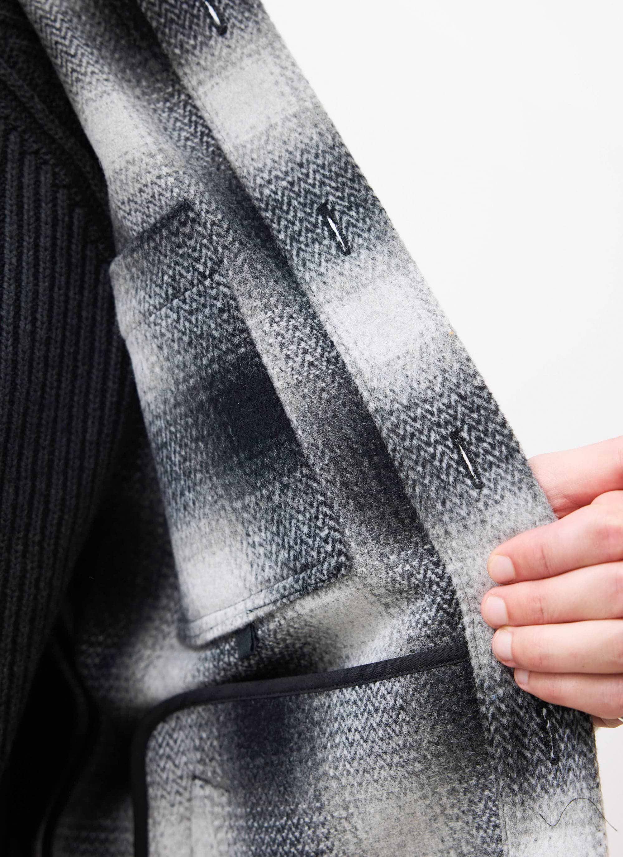 Close-up of the Percival grey Check Overshirt's interior, detailing the wool-blend fabric and internal pockets.