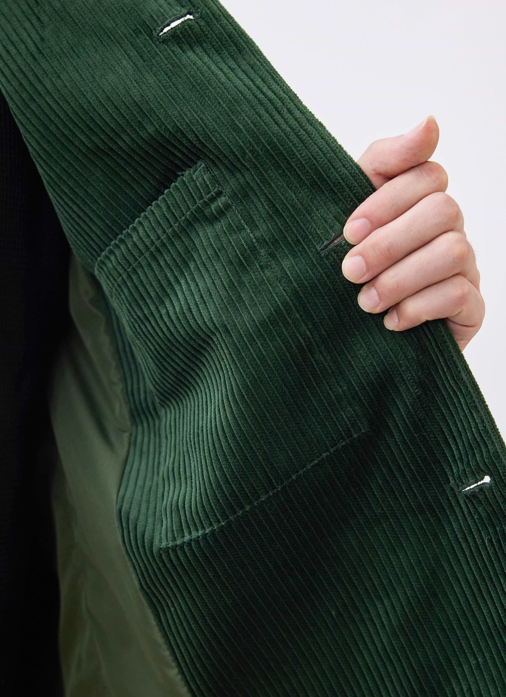 A close-up of the internal pocket detail on the Percival Cord Overshirt in forest green heavyweight corduroy.