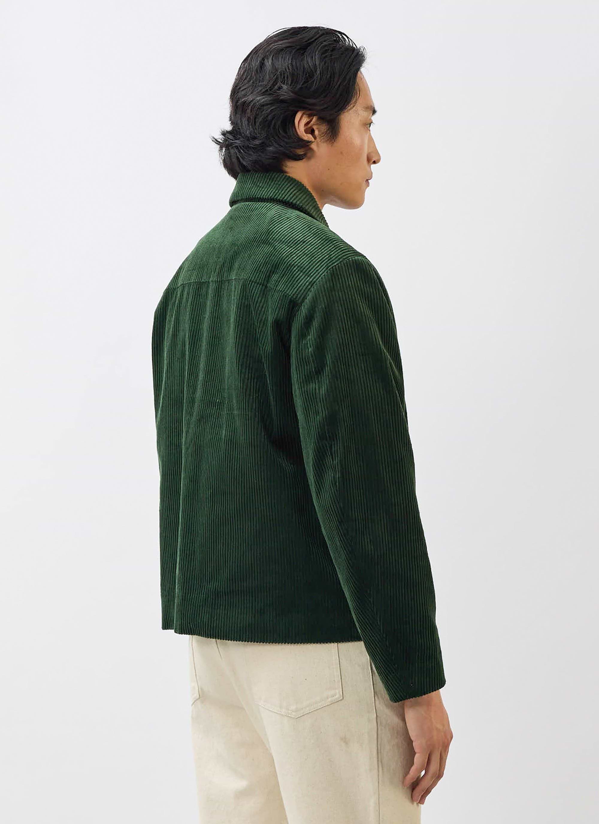 A model wears the Percival Cord Overshirt in forest green, showing the back and side profile against a white background.