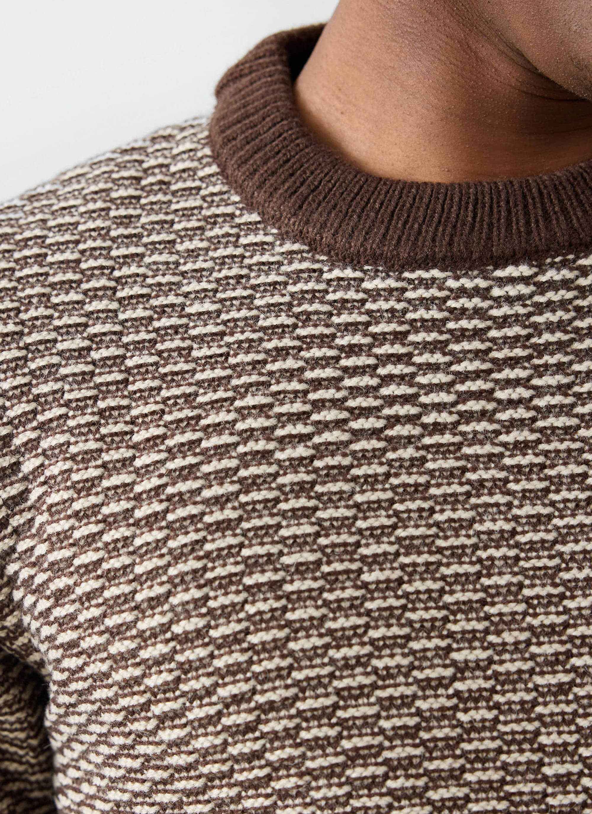 Close-up of the Percival Charlestown Knitted Jumper in chocolate beige, showing the textured knit and brown ribbed crew neck.