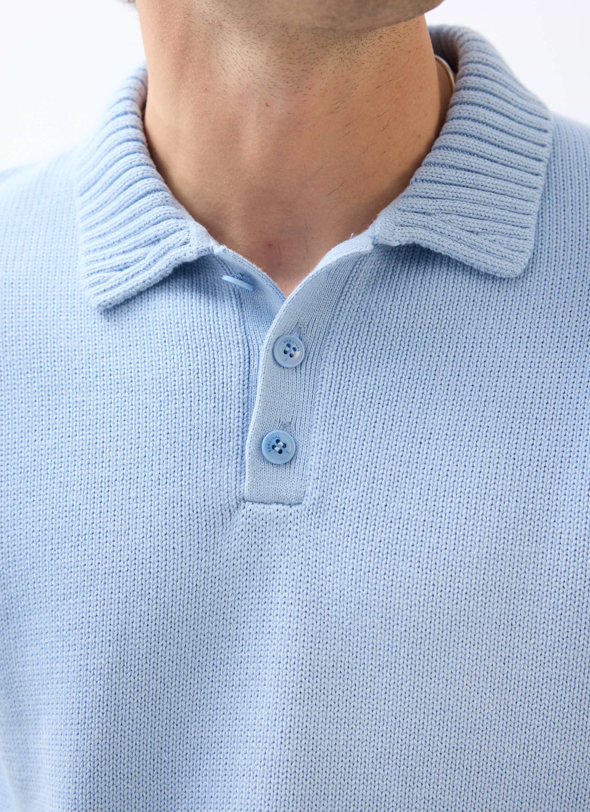 A close-up of the Percival Verso Short Sleeve Knitted Shirt in heather blue, showing the ribbed collar and button placket.