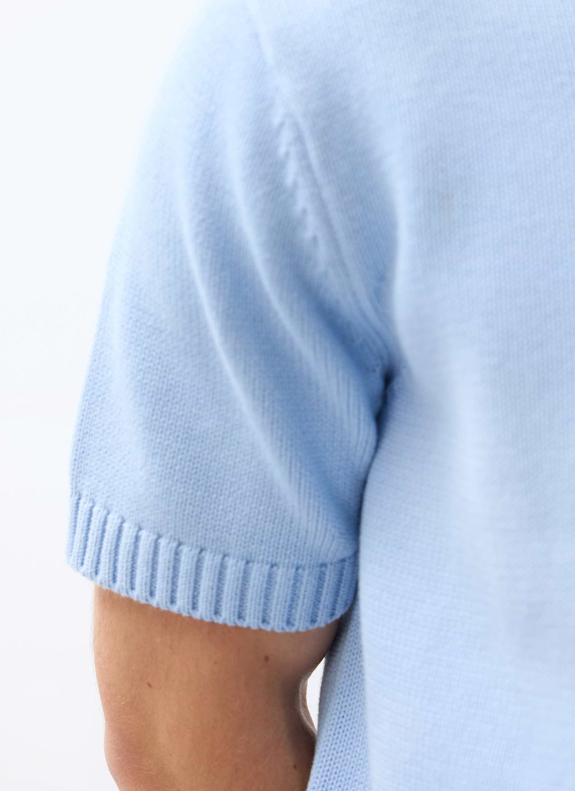 Close-up of the ribbed sleeve detail on the Percival Verso Short Sleeve Knitted Shirt in heather blue cotton.