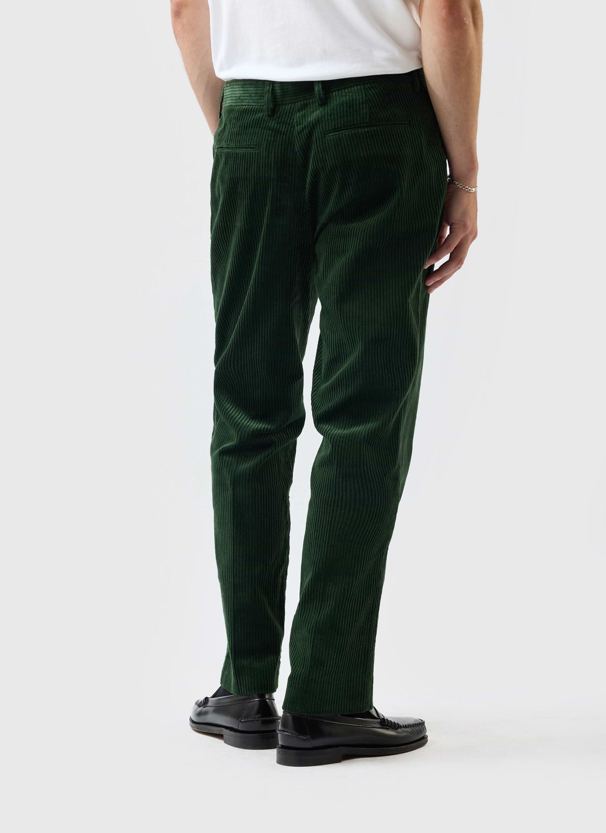 The Percival Tailored Chunky Cord Trousers in forest green, shown on a model from the back to highlight the straight leg fit.