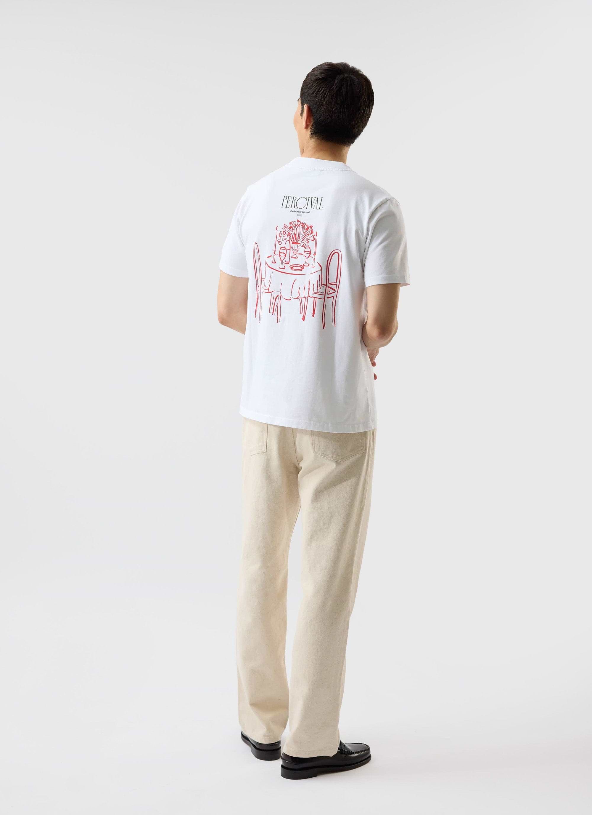A model seen from behind wears the white Percival Bistro T-shirt, showing the red embroidered graphic on the back.