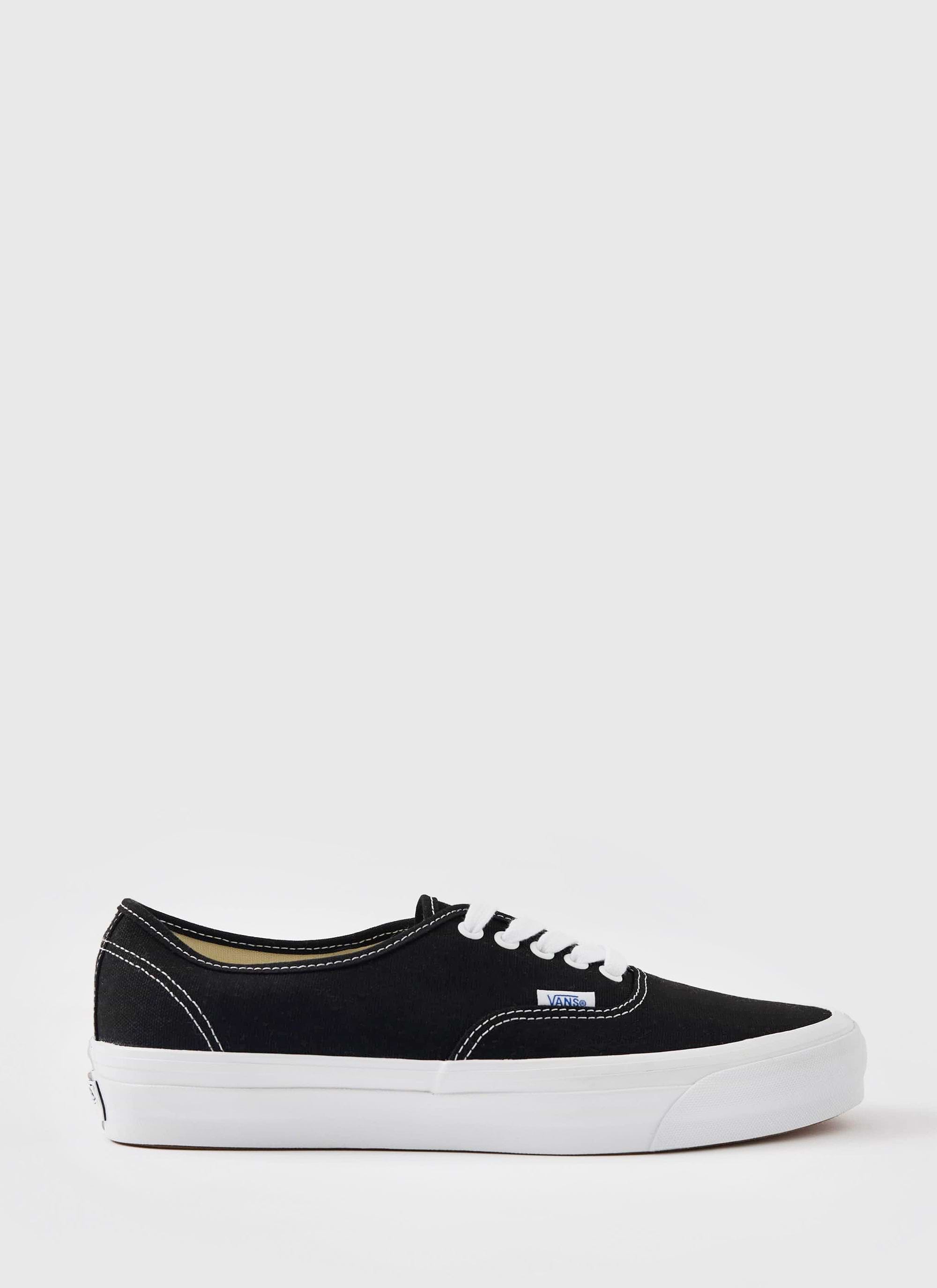 A single black Vans Premium Authentic 44 shoe with a white sole and laces, shot against a white background for Percival.