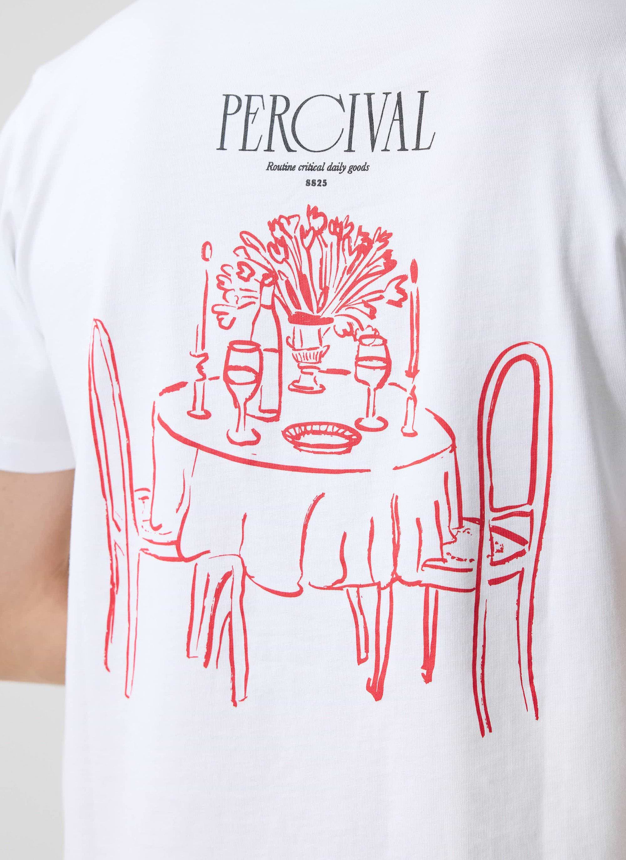 A close-up of the back of the white Percival Bistro T-shirt, featuring the red embroidered graphic of a bistro table.