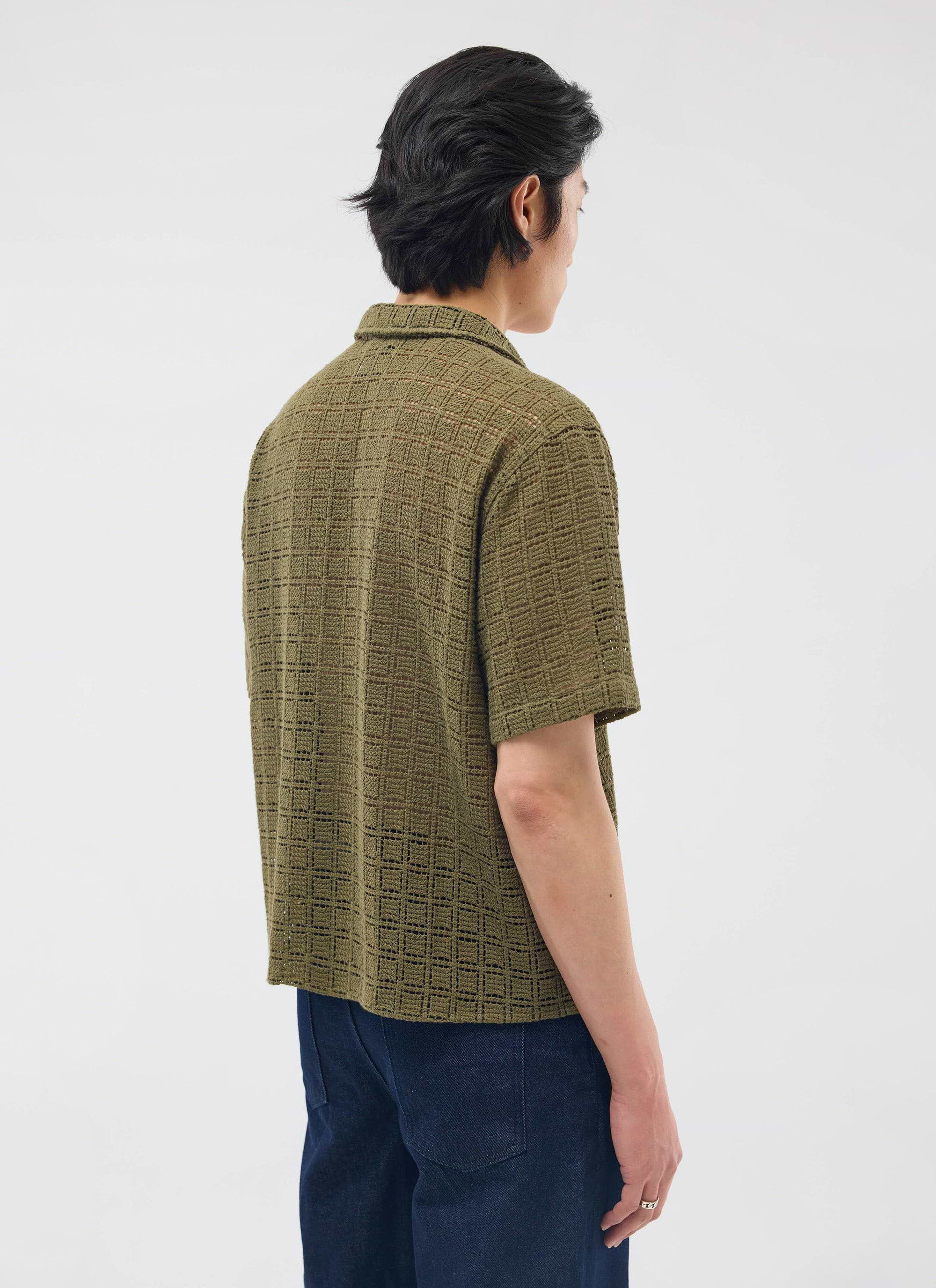 A model seen from behind, wearing the olive green Palermo Crochet Cuban Shirt from Percival.