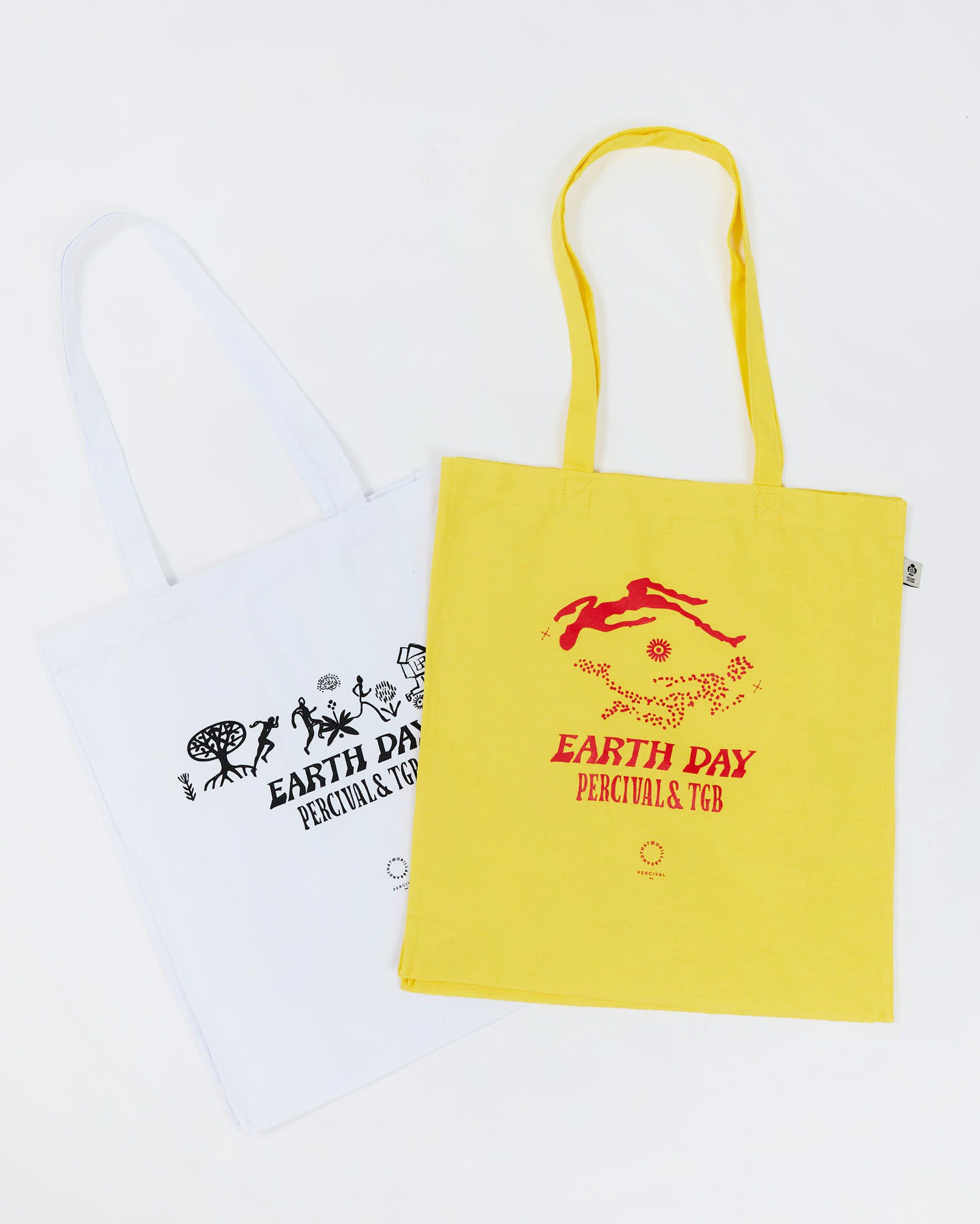 The Percival x The Gorilla Brand Earth Day tote bags, shown in both ecru and yellow colourways on a white background.