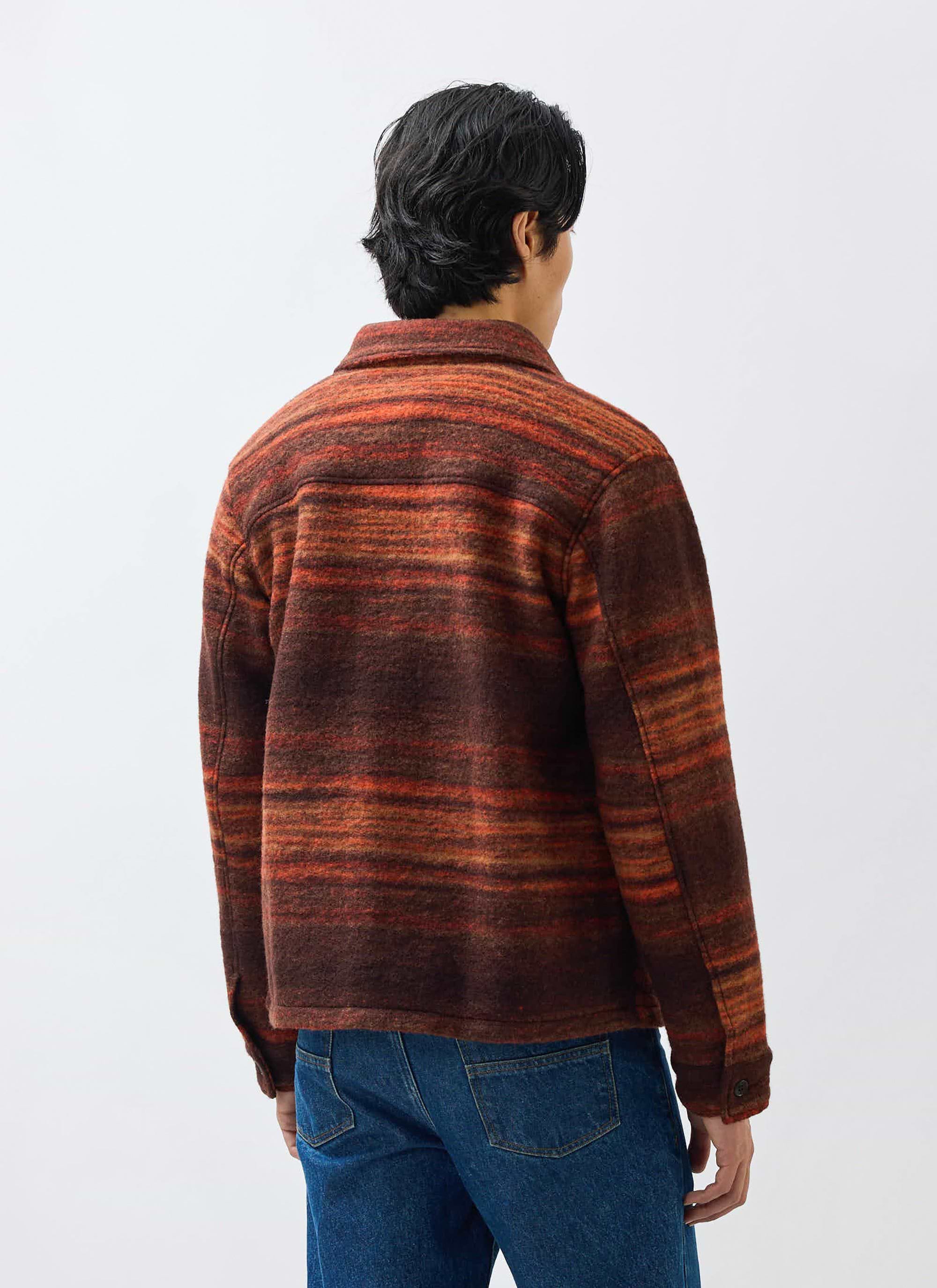 A model seen from behind, wearing the Percival Mississippi Jacquard Overshirt in a burnt orange and brown wool blend.
