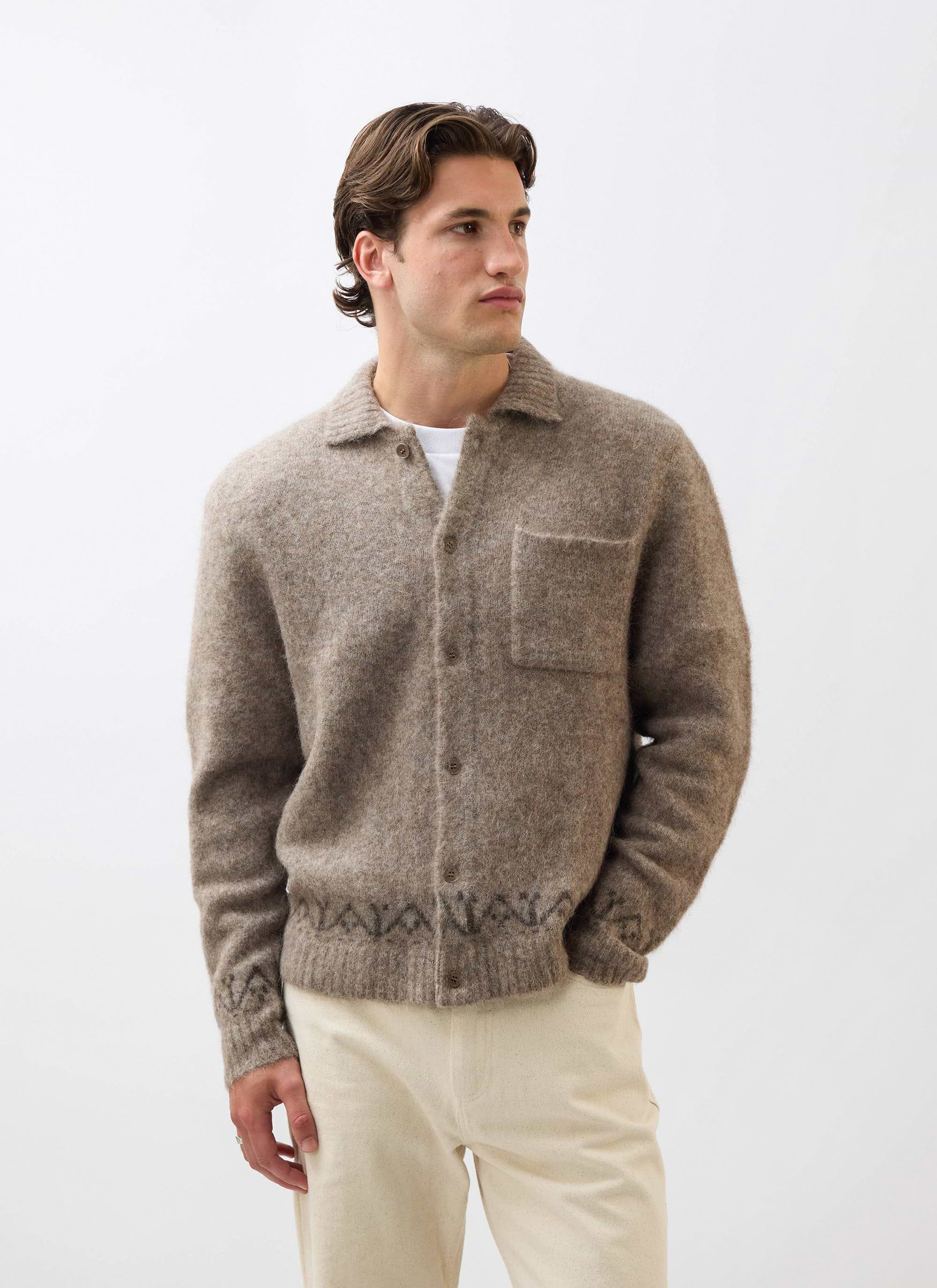 A model wears the Percival Novel Collared Cardigan in oak, a soft wool-blend knit, styled with light-coloured trousers.