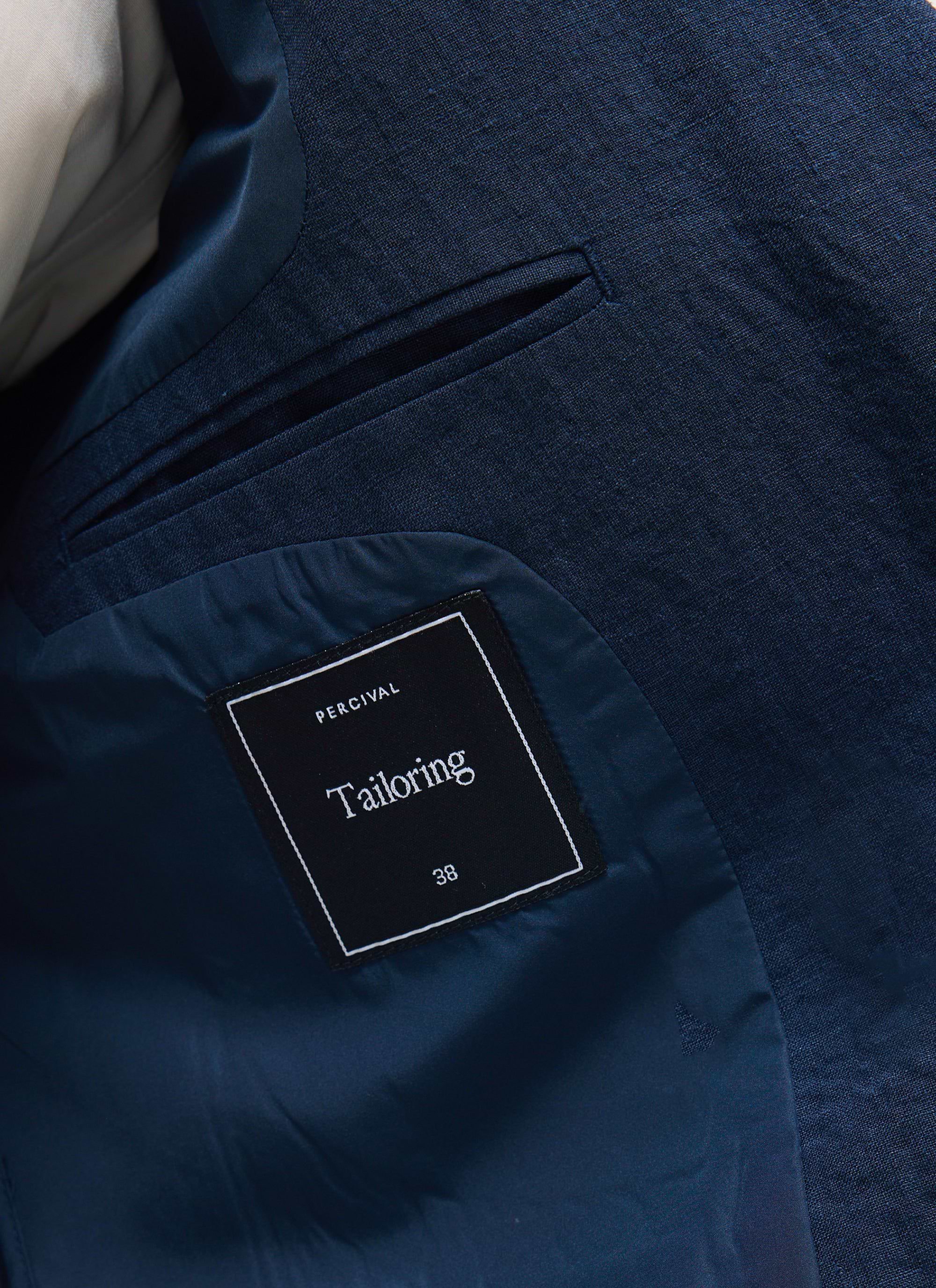 Close up shot of the inner pocket and branding label on the Percival Tailored Double Breasted Blazer in navy linen.