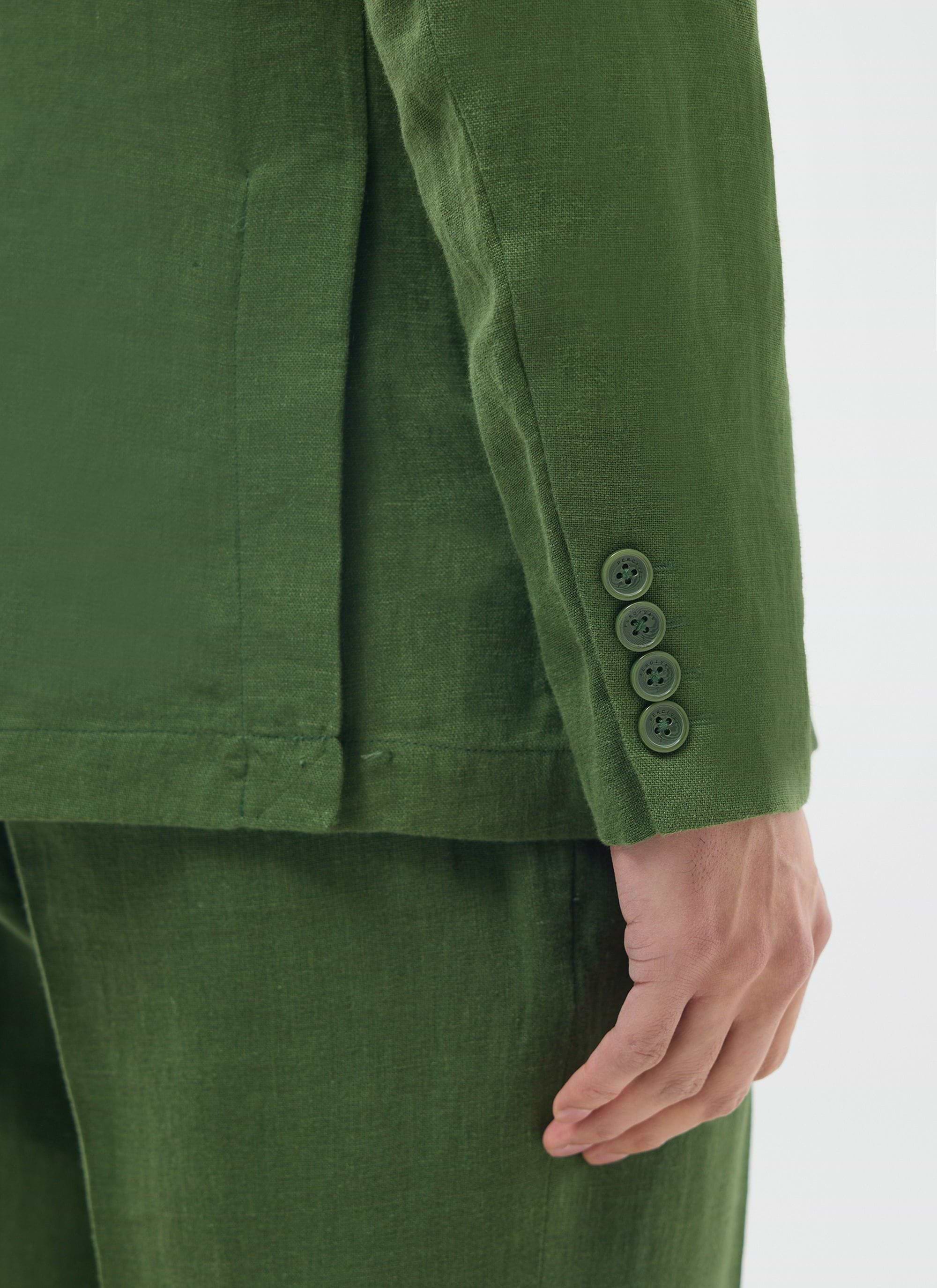 close up of the sleeve and buttoned cuff on the percival forest green linen blazer
